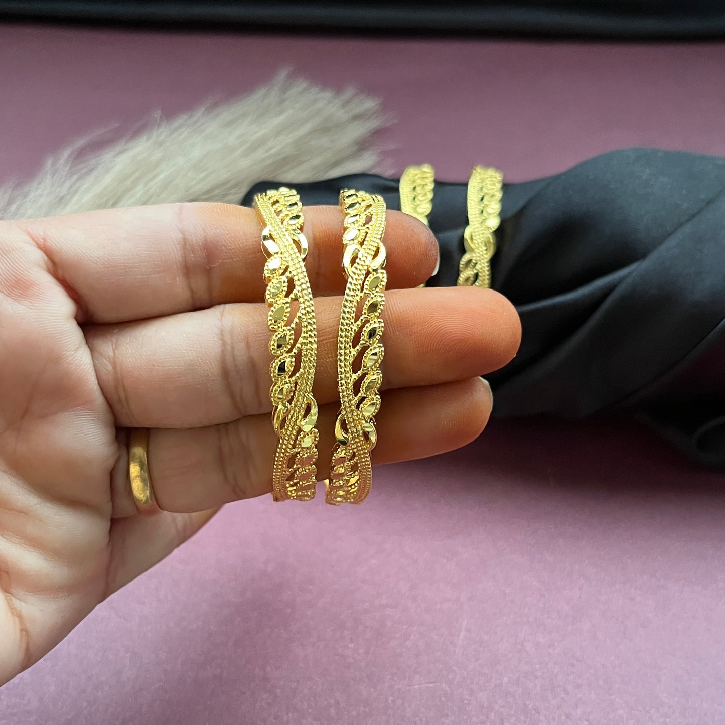 Traditional gold tone bangles with carved detailing imitation jewelry for weddings.Glossy gold look bangles in classic design party wear imitation bangles for women
