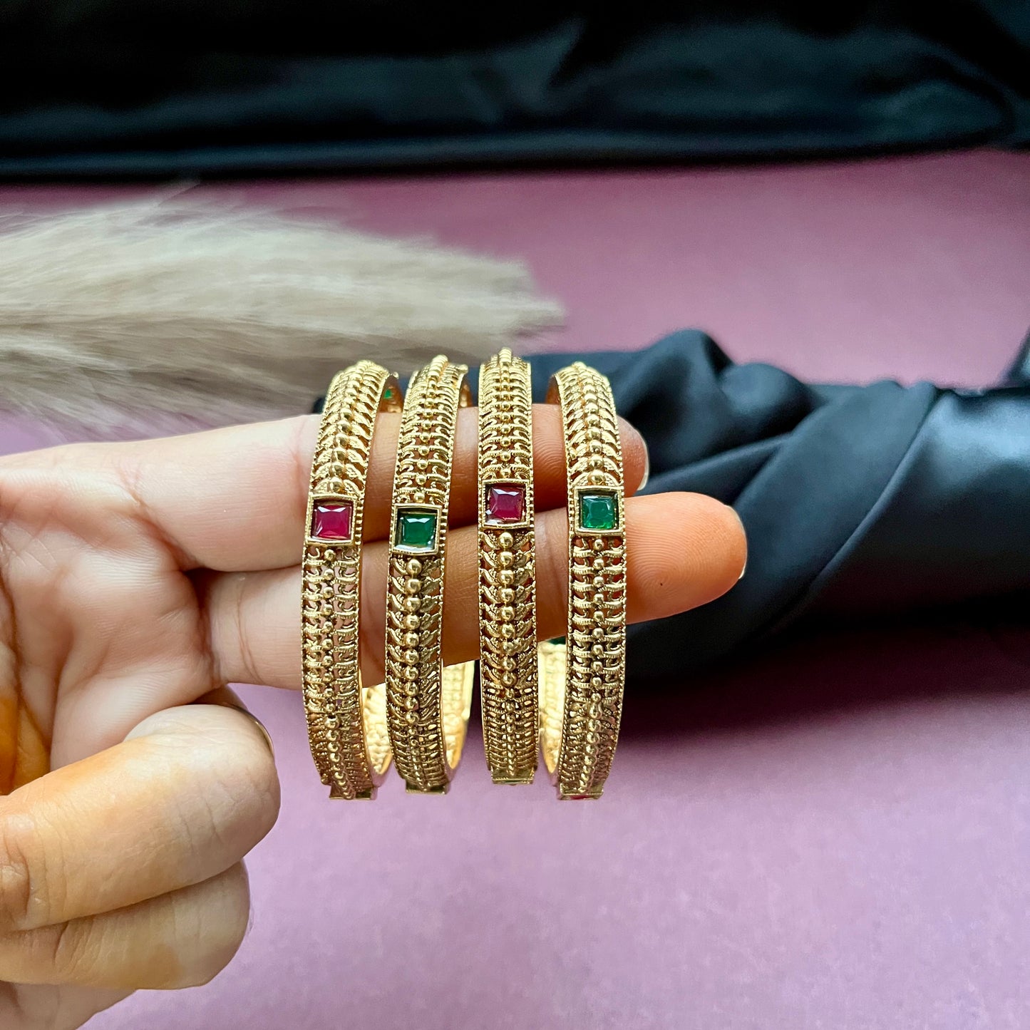 Traditional gold tone bangles with carved detailing imitation jewelry for weddings.Glossy gold look bangles in classic design party wear imitation bangles for women
