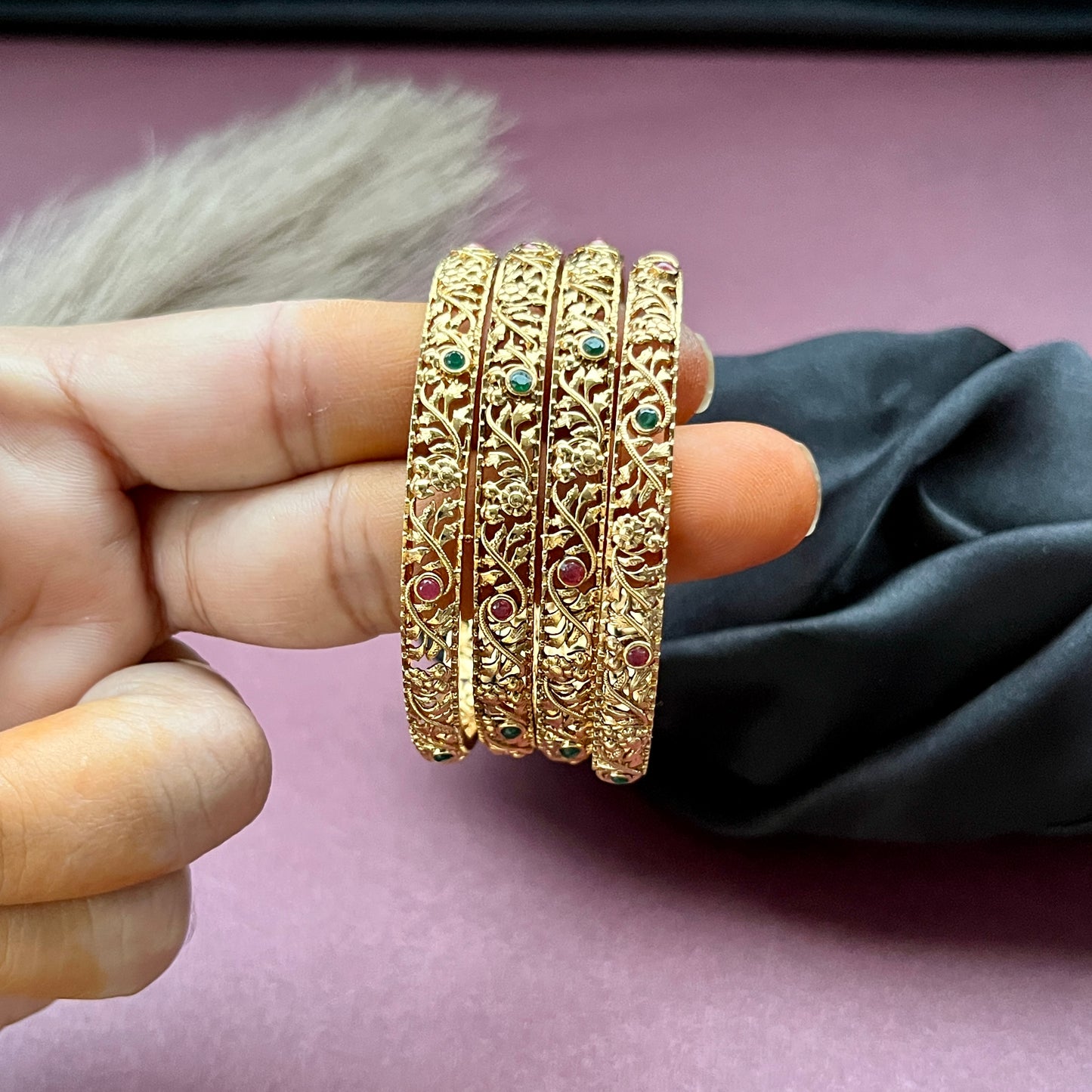 Traditional gold tone bangles with carved detailing imitation jewelry for weddings.Glossy gold look bangles in classic design party wear imitation bangles for women