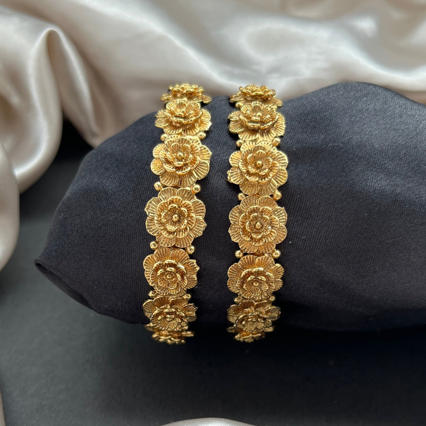 Traditional gold tone bangles with carved detailing imitation jewelry for weddings.Glossy gold look bangles in classic design party wear imitation bangles for women