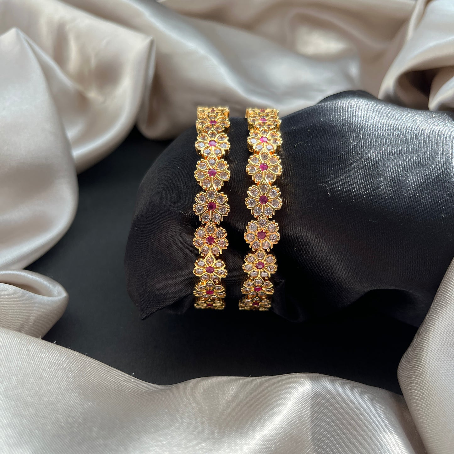 Traditional gold tone bangles with carved detailing imitation jewelry for weddings.Glossy gold look bangles in classic design party wear imitation bangles for women