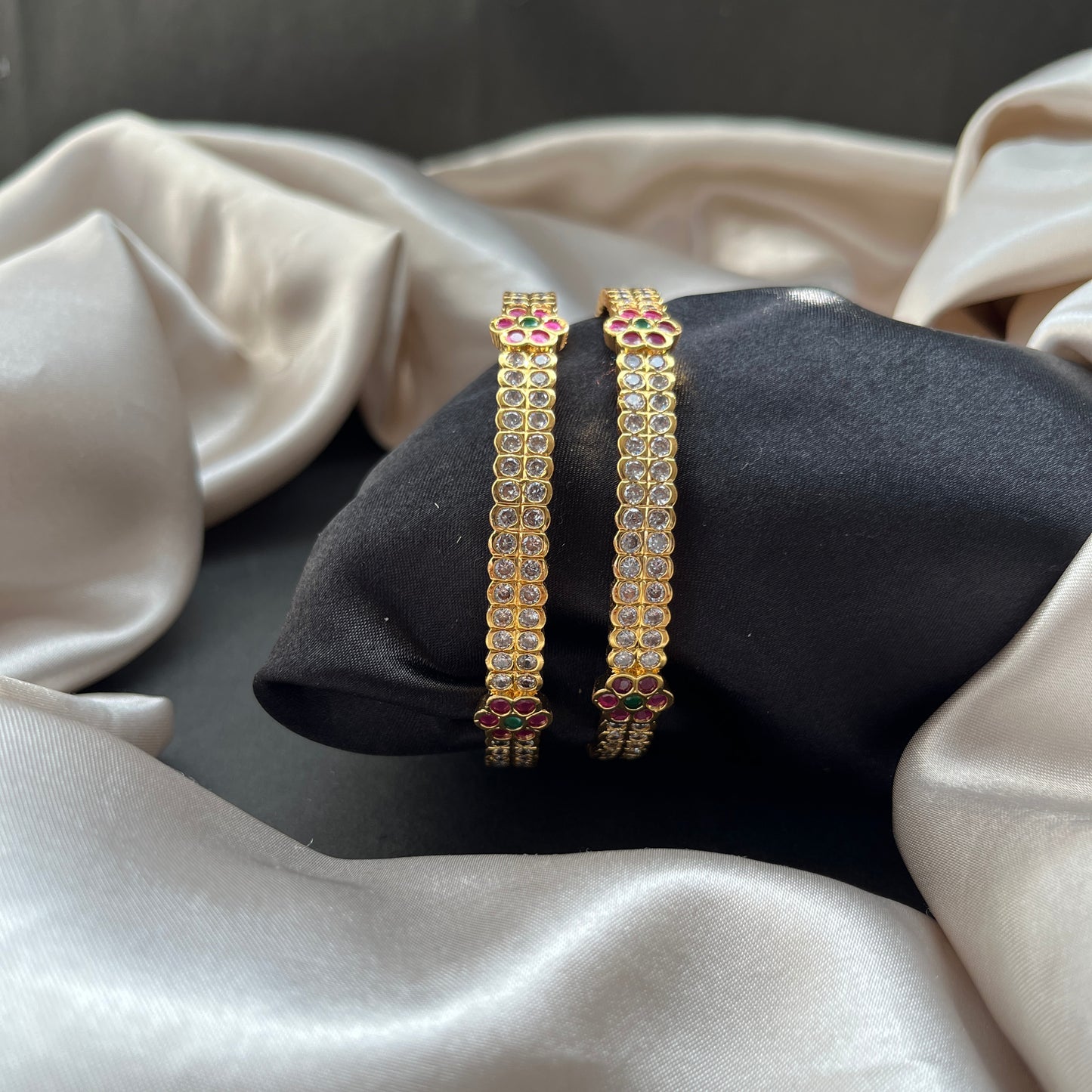 Traditional gold tone bangles with carved detailing imitation jewelry for weddings.Glossy gold look bangles in classic design party wear imitation bangles for women