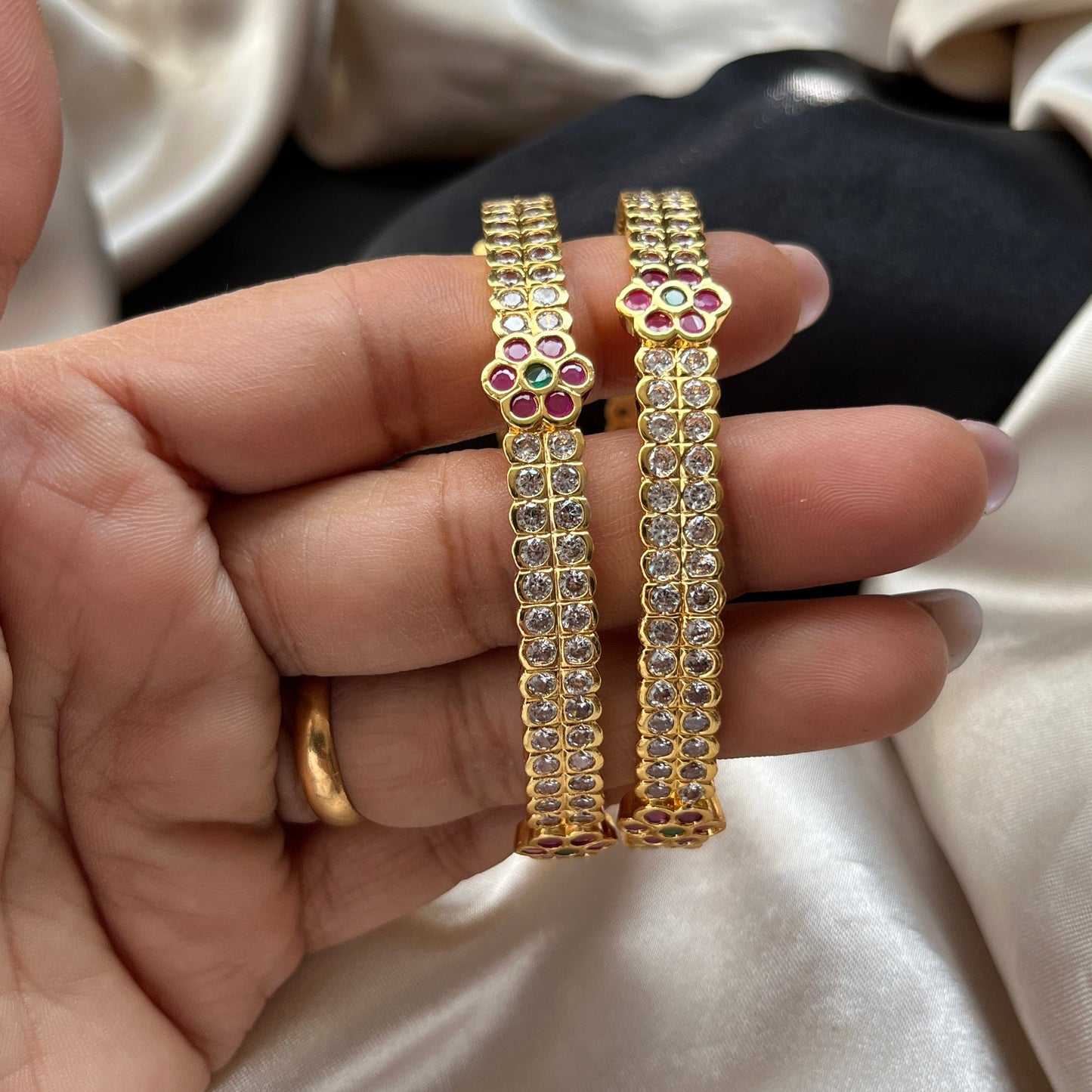 Traditional gold tone bangles with carved detailing imitation jewelry for weddings.Glossy gold look bangles in classic design party wear imitation bangles for women