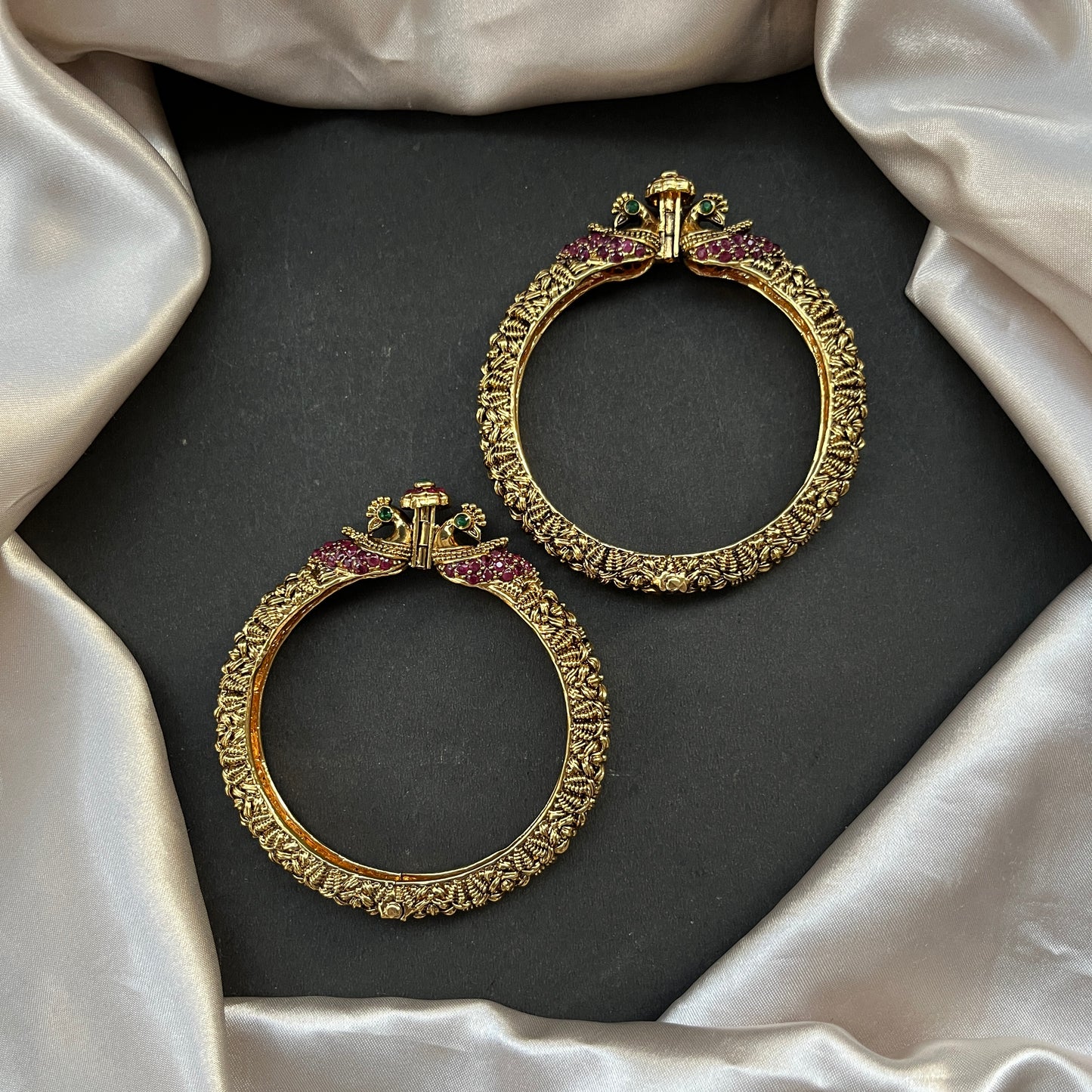 Traditional gold tone bangles with carved detailing imitation jewelry for weddings.Glossy gold look bangles in classic design β party wear imitation bangles for women