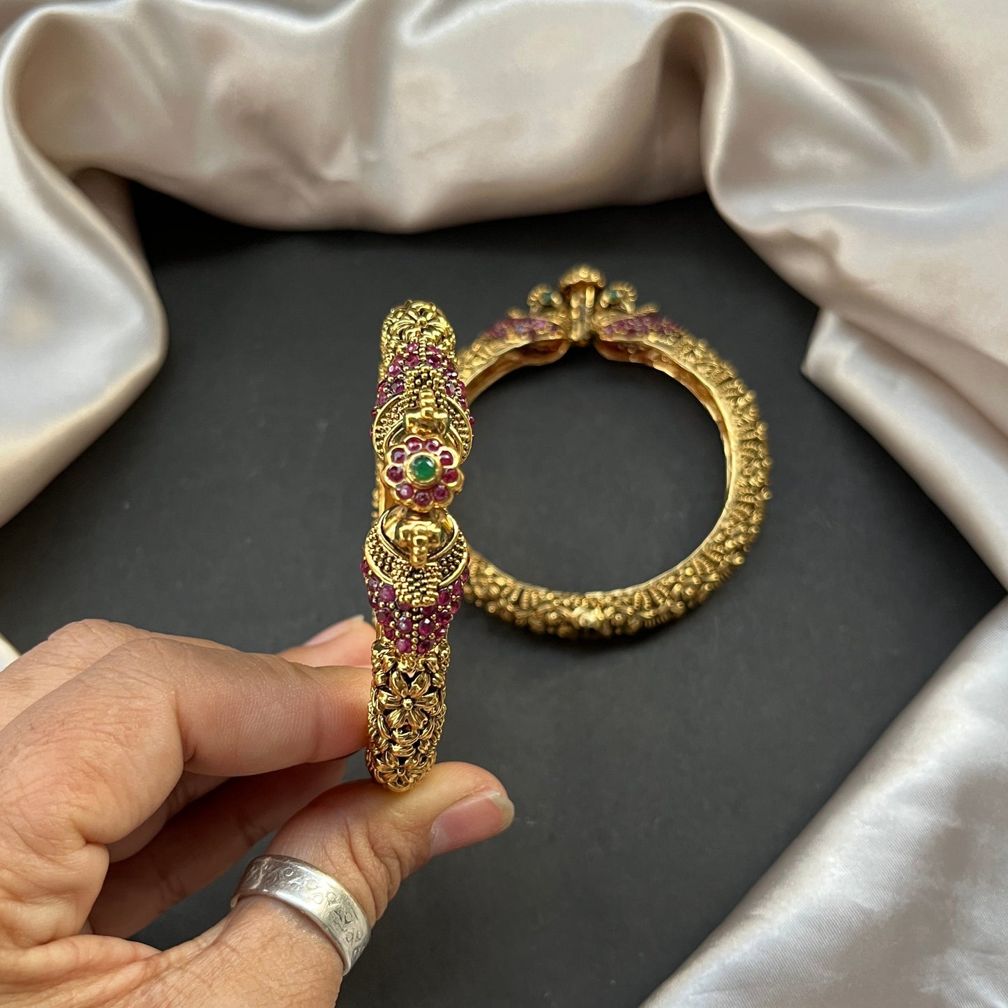 Traditional gold tone bangles with carved detailing imitation jewelry for weddings.Glossy gold look bangles in classic design β party wear imitation bangles for women