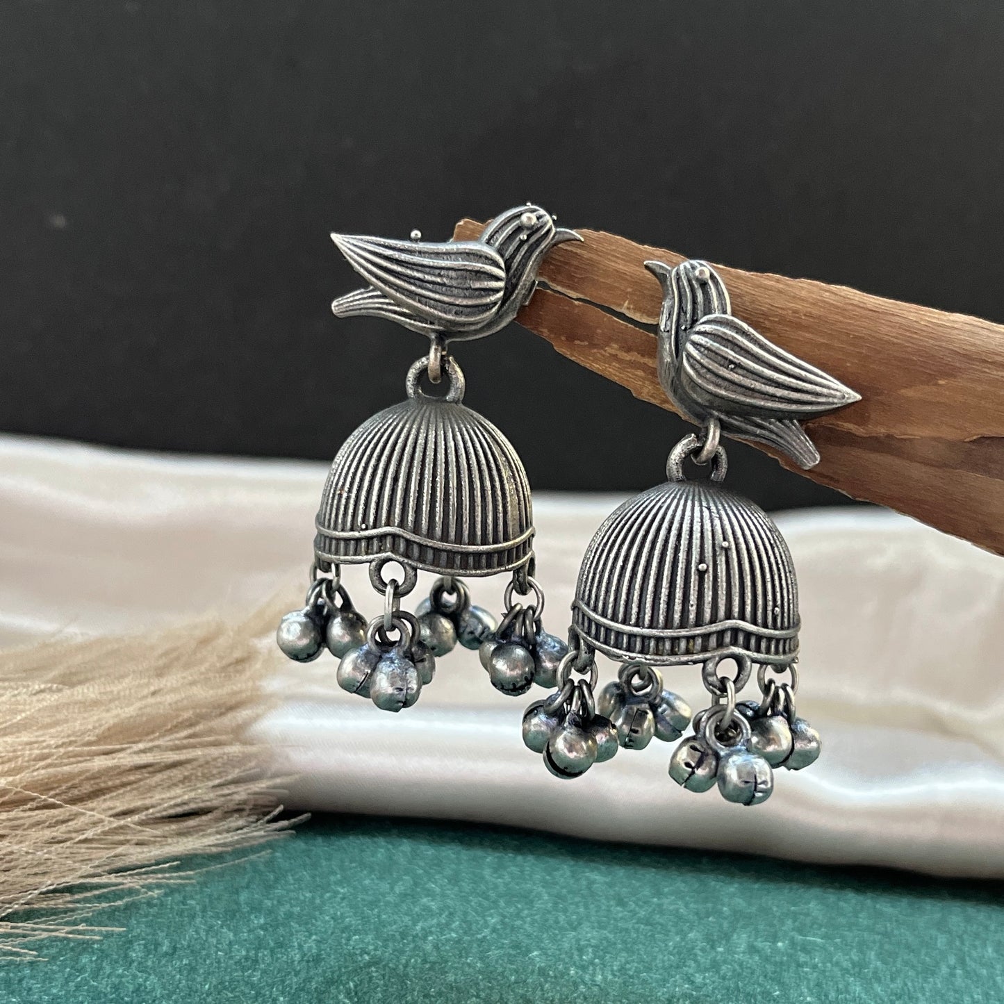 German silver look jhumka earrings oxidised finish with intricate temple design, perfect for festive wear,Vintage German silver look hoop earrings boho inspired design for casual and traditional wear