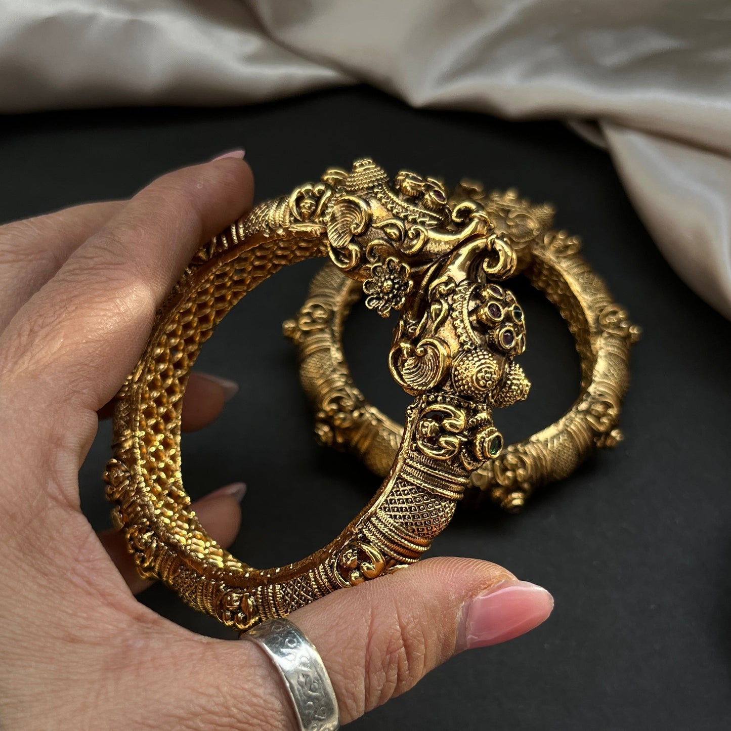 Traditional gold tone bangles with carved detailing imitation jewelry for weddings.Glossy gold look bangles in classic design party wear imitation bangles for women