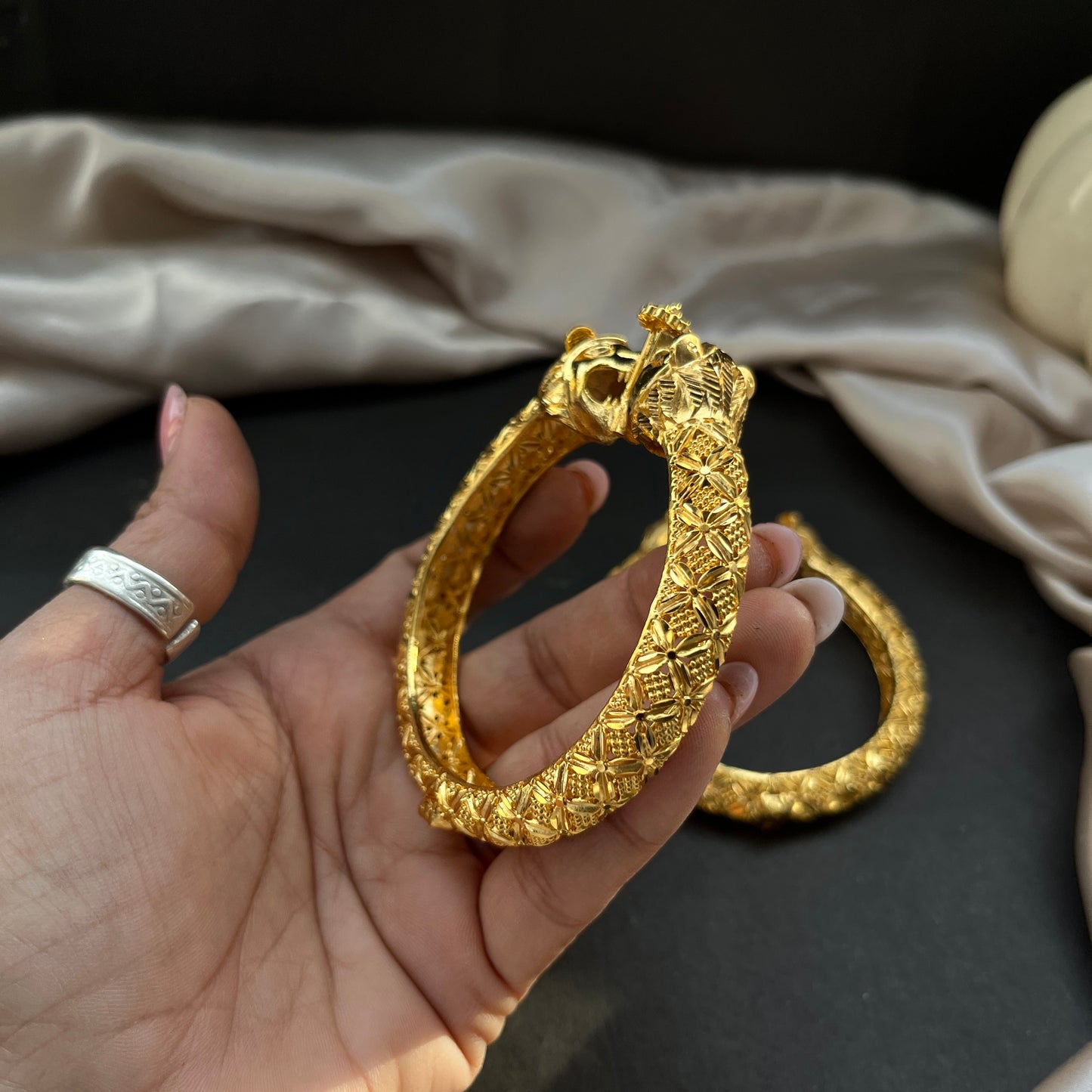 Traditional gold tone bangles with carved detailing imitation jewelry for weddings.Glossy gold look bangles in classic design party wear imitation bangles for women