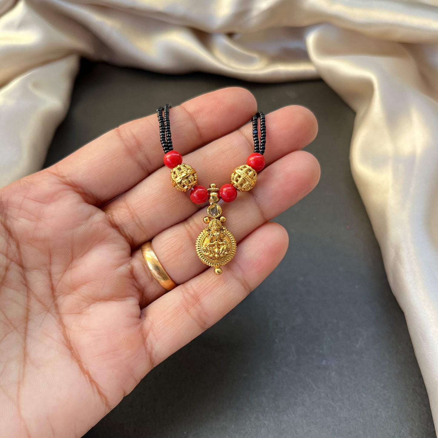 Kasu Coral Mangalsutra Traditional South Indian Mangalsutra Coral Beaded Necklace Kasu Coin Jewellery Bridal Mangalsutra Design Heritage Jewellery Online Handcrafted Indian Jewellery Festive Jewellery Collection Coral and Gold Tone Necklace Temple Jewellery Inspired