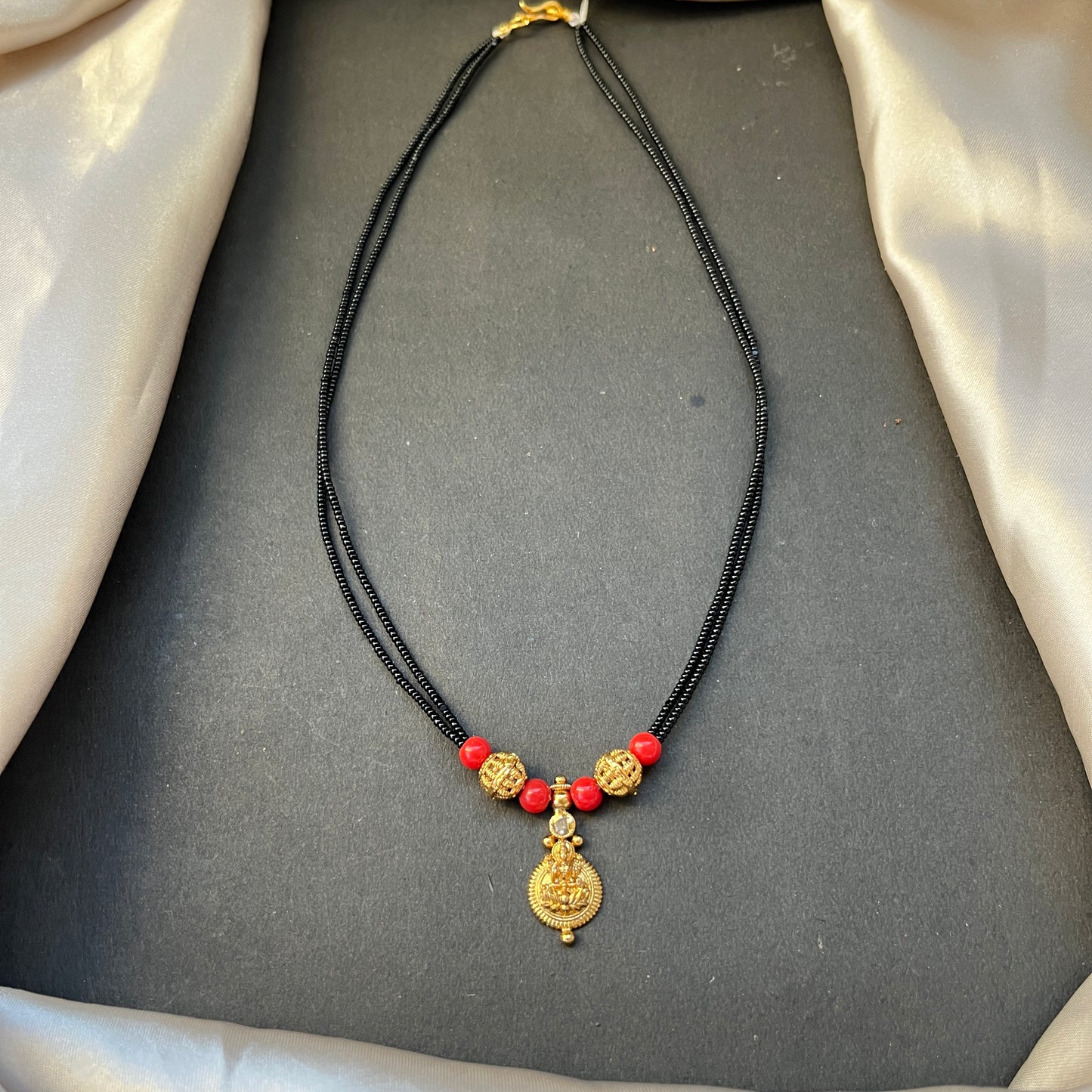 Kasu Coral Mangalsutra Traditional South Indian Mangalsutra Coral Beaded Necklace Kasu Coin Jewellery Bridal Mangalsutra Design Heritage Jewellery Online Handcrafted Indian Jewellery Festive Jewellery Collection Coral and Gold Tone Necklace Temple Jewellery Inspired
