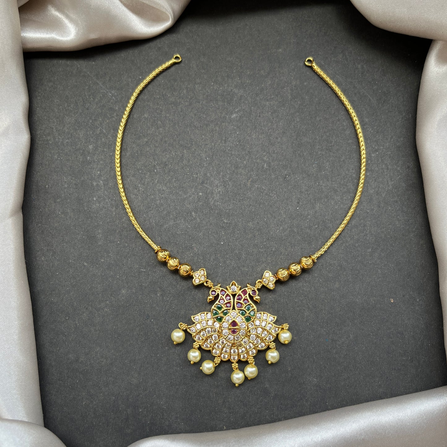 Gold look alike necklace set,Imitation jewelry,Artificial necklace set,Bridal / festive wear,Temple design / kundan / matte gold finish,Designer / traditional / ethnic
