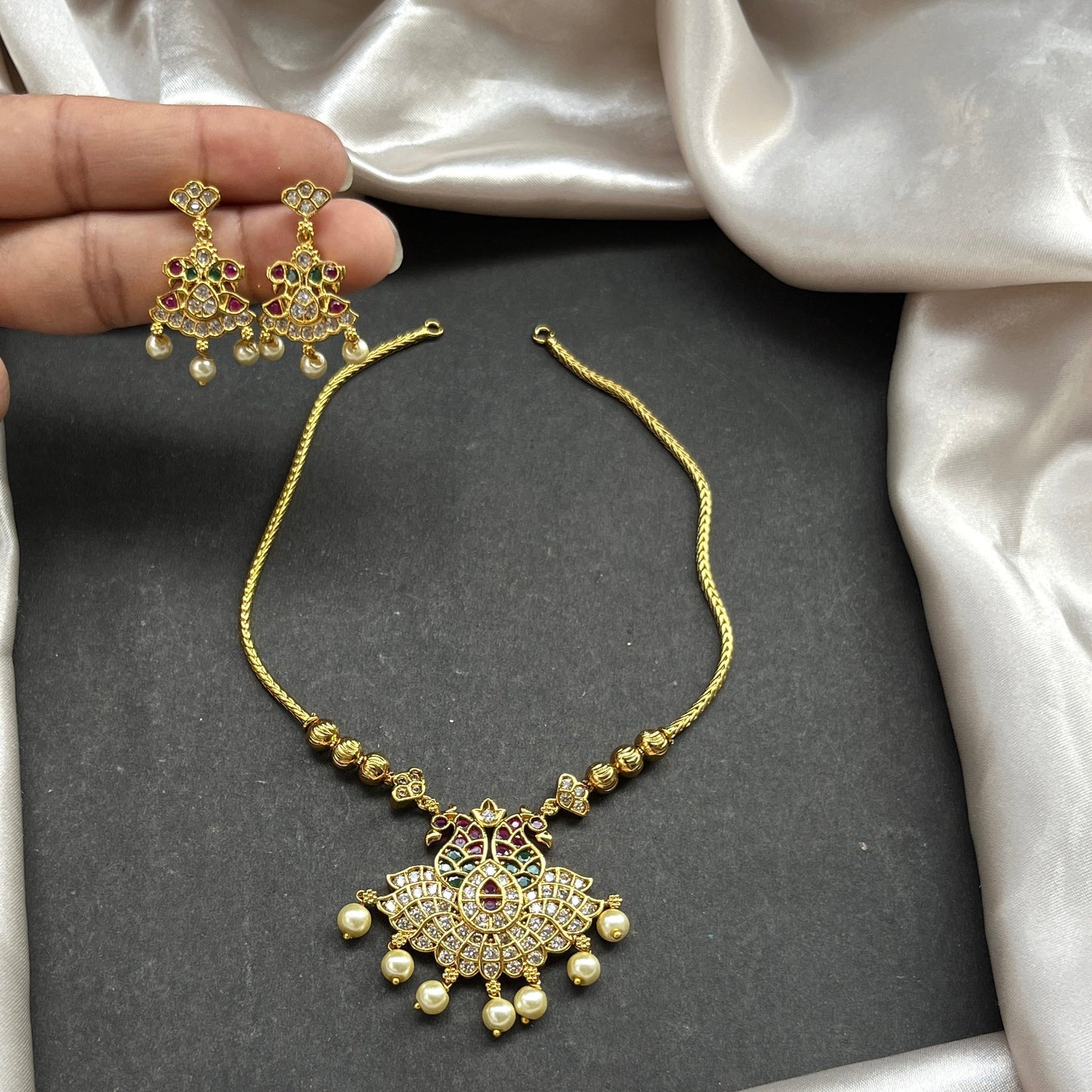 Gold look alike necklace set,Imitation jewelry,Artificial necklace set,Bridal / festive wear,Temple design / kundan / matte gold finish,Designer / traditional / ethnic