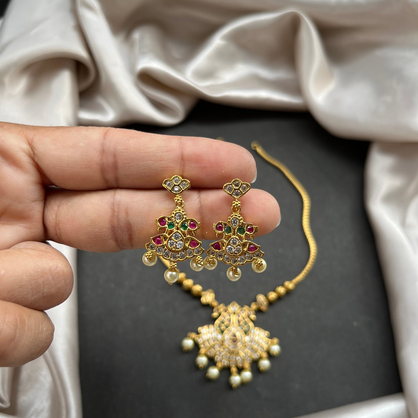 Gold look alike necklace set,Imitation jewelry,Artificial necklace set,Bridal / festive wear,Temple design / kundan / matte gold finish,Designer / traditional / ethnic