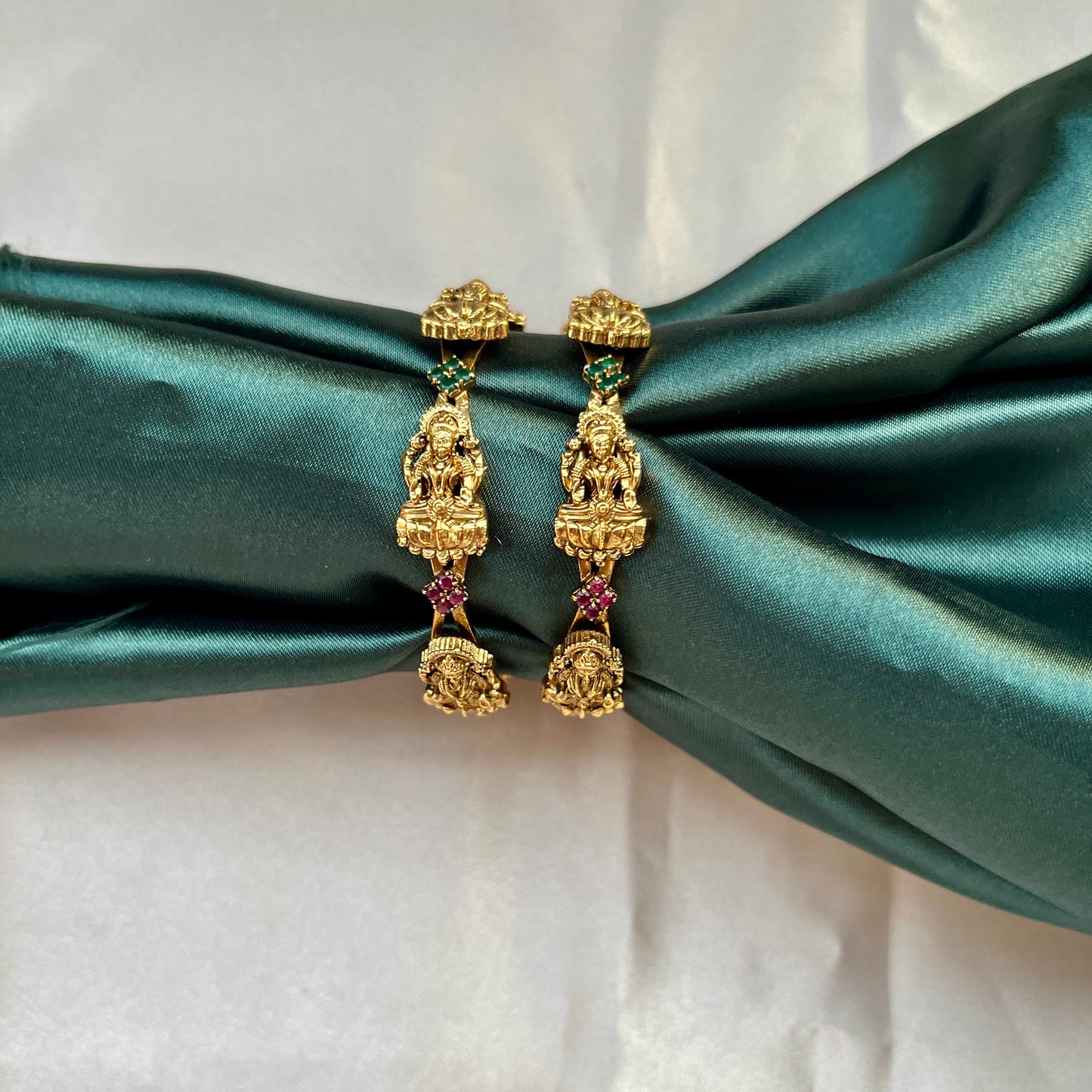 Traditional gold tone bangles with carved detailing imitation jewelry for weddings.Glossy gold look bangles in classic design  party wear imitation bangles for women
