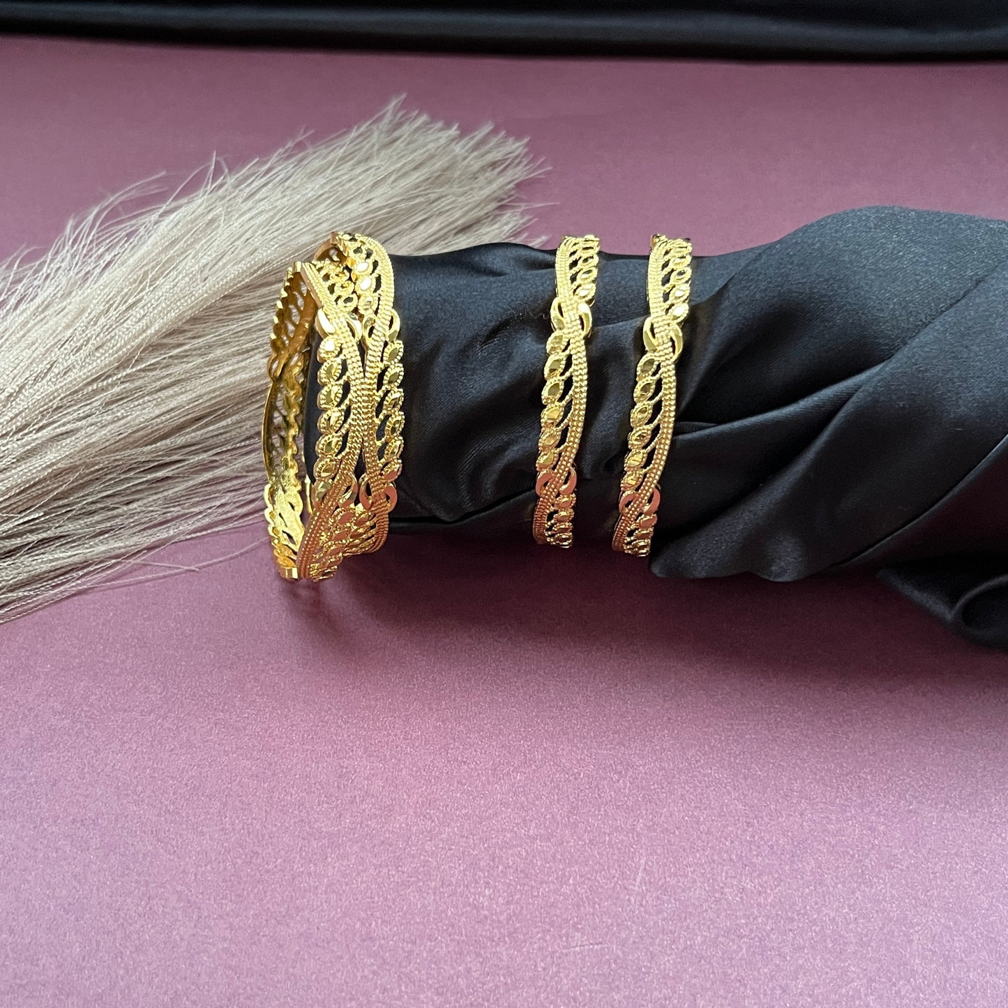 Traditional gold tone bangles with carved detailing imitation jewelry for weddings.Glossy gold look bangles in classic design  party wear imitation bangles for women
