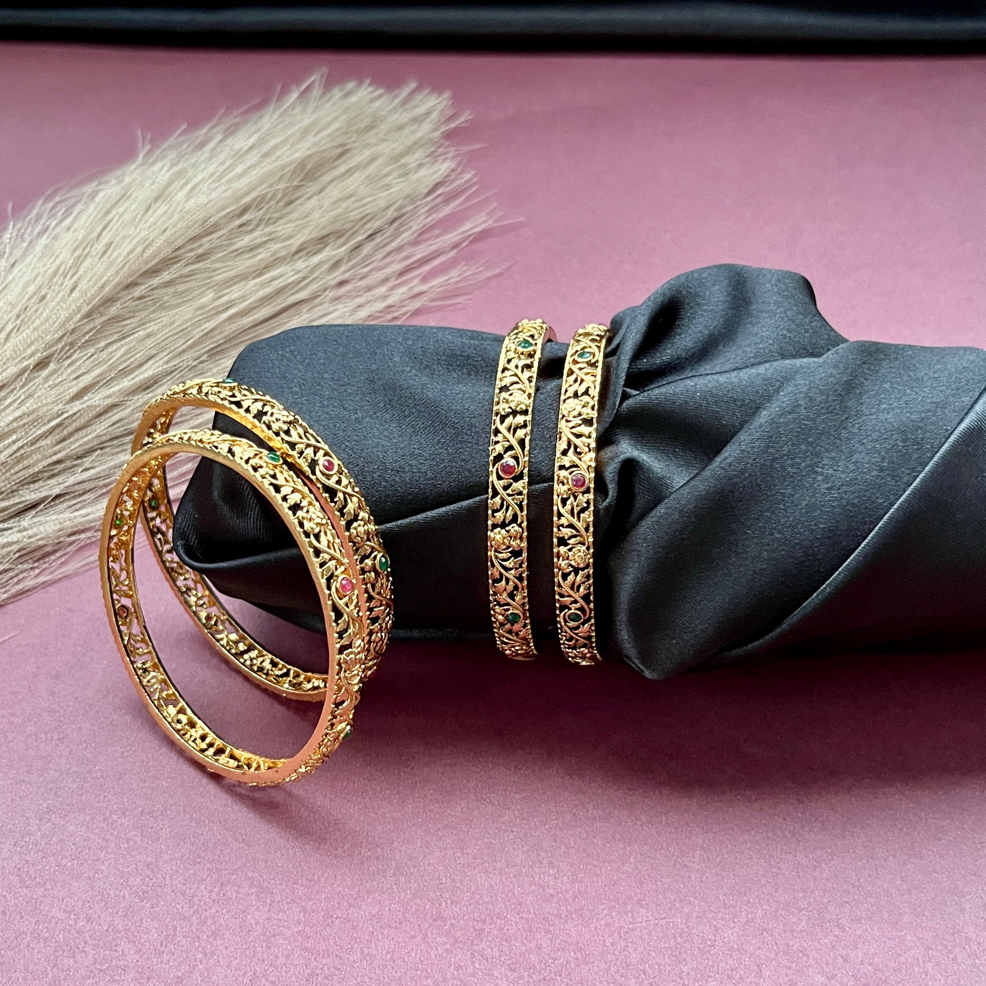 Traditional gold tone bangles with carved detailing imitation jewelry for weddings.Glossy gold look bangles in classic design  party wear imitation bangles for women