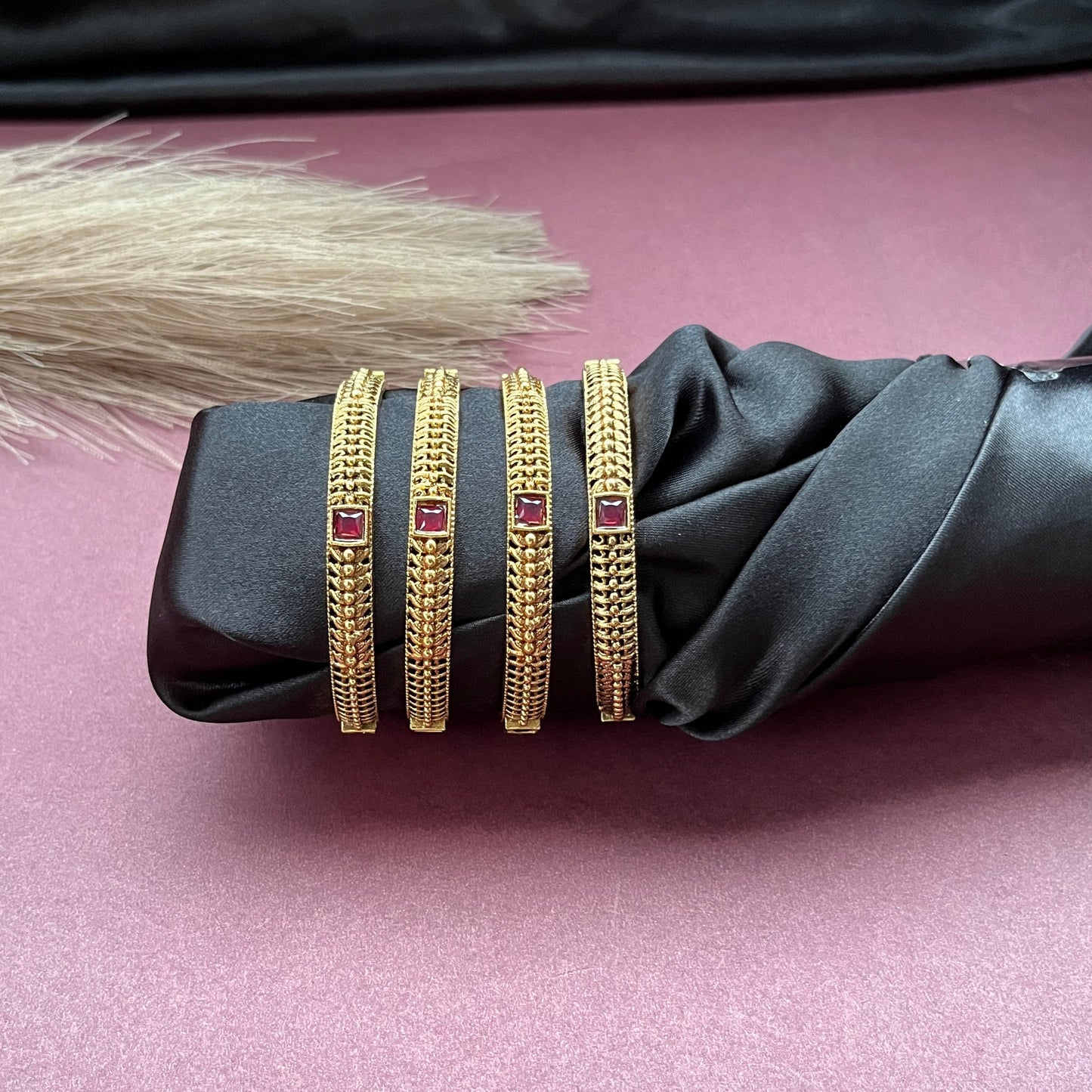 Traditional gold tone bangles with carved detailing imitation jewelry for weddings.Glossy gold look bangles in classic design  party wear imitation bangles for women
