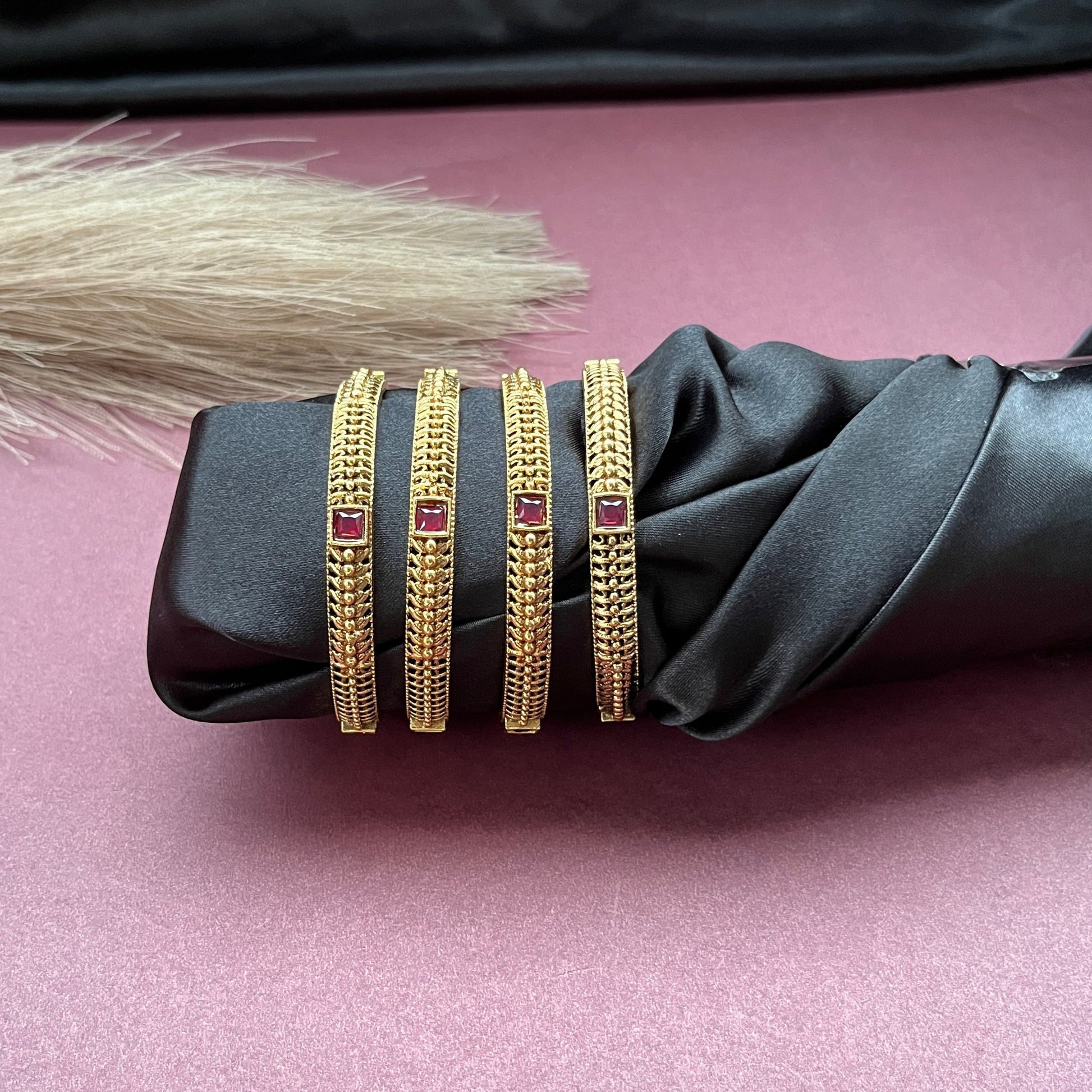 Traditional gold tone bangles with carved detailing imitation jewelry for weddings.Glossy gold look bangles in classic design  party wear imitation bangles for women