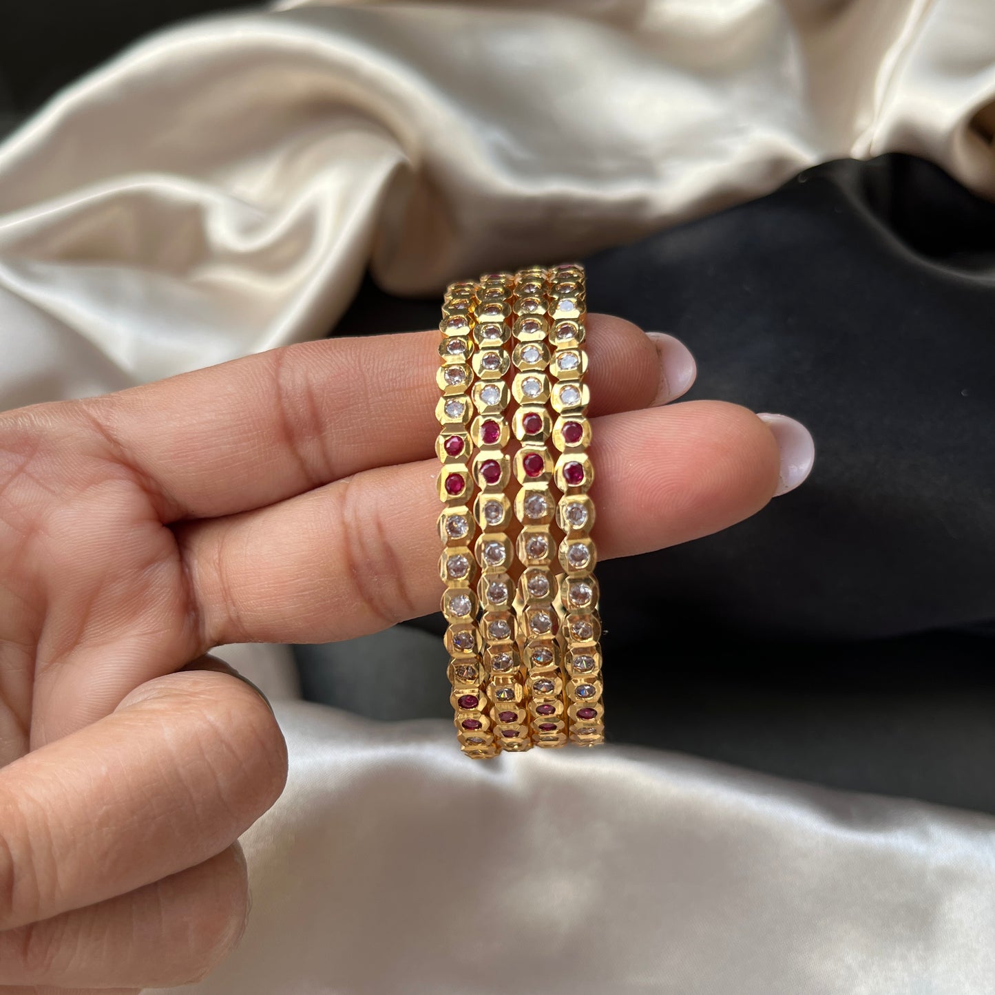 Traditional gold tone bangles with carved detailing imitation jewelry for weddings.Glossy gold look bangles in classic design  party wear imitation bangles for women