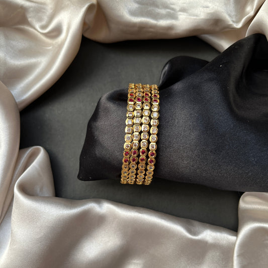 Traditional gold tone bangles with carved detailing imitation jewelry for weddings.Glossy gold look bangles in classic design  party wear imitation bangles for women