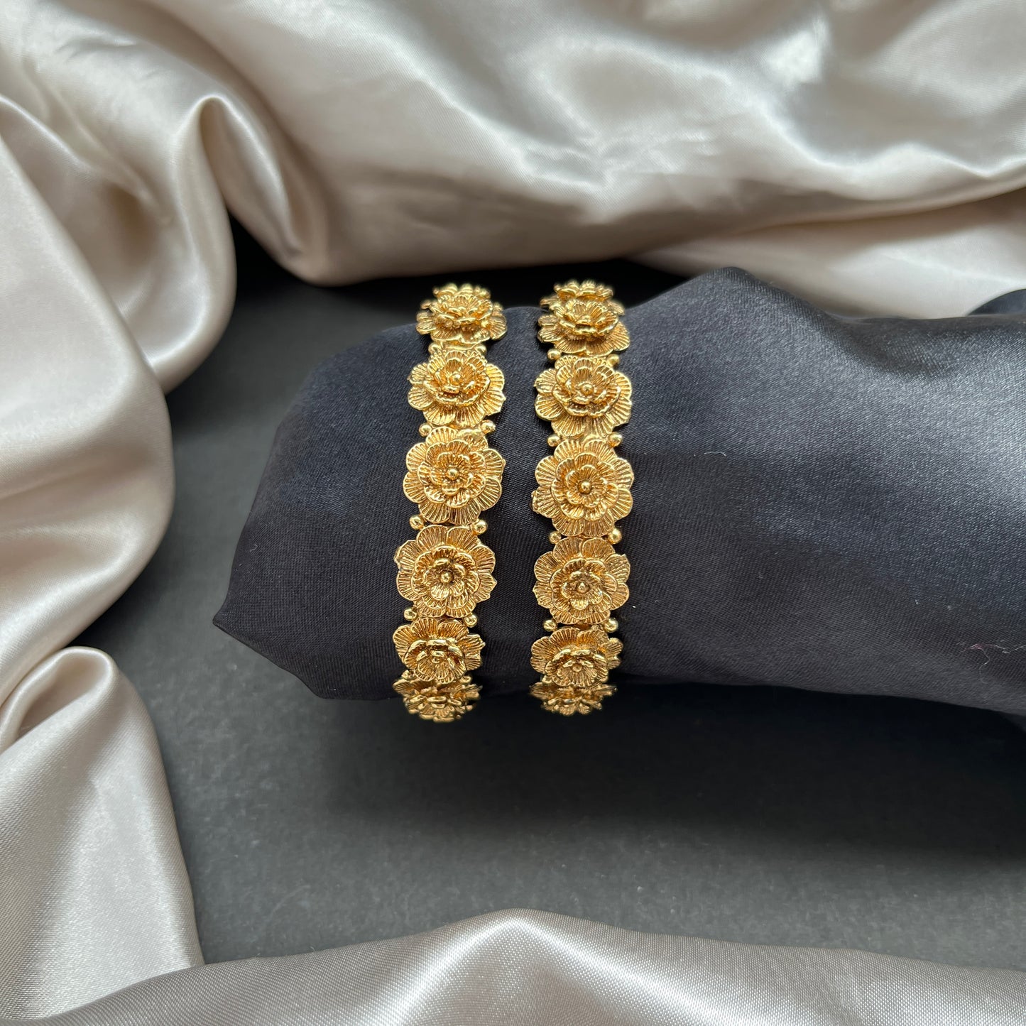 Traditional gold tone bangles with carved detailing imitation jewelry for weddings.Glossy gold look bangles in classic design  party wear imitation bangles for women