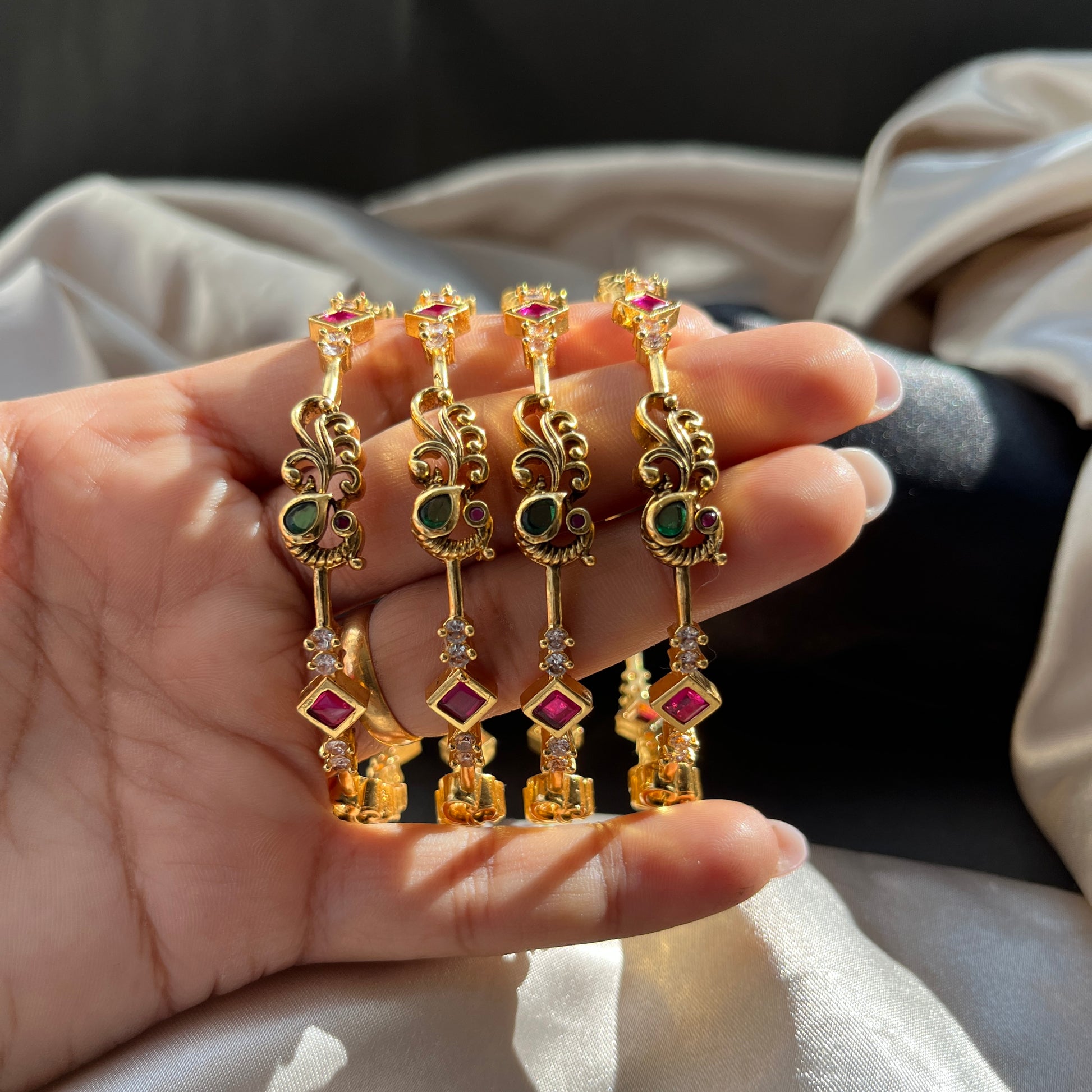 Traditional gold tone bangles with carved detailing imitation jewelry for weddings.Glossy gold look bangles in classic design  party wear imitation bangles for women