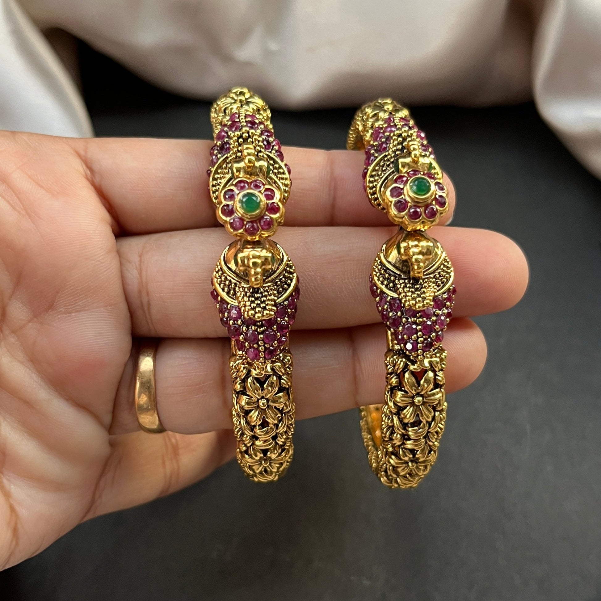 Traditional gold tone bangles with carved detailing imitation jewelry for weddings.Glossy gold look bangles in classic design – party wear imitation bangles for women