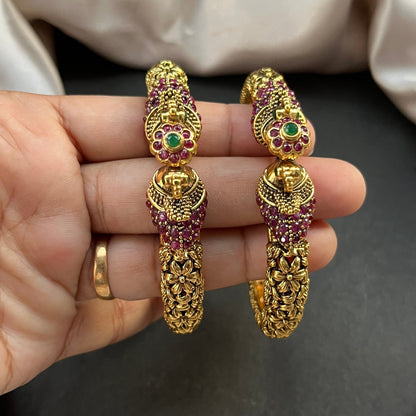 Traditional gold tone bangles with carved detailing imitation jewelry for weddings.Glossy gold look bangles in classic design – party wear imitation bangles for women