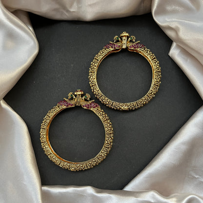 Traditional gold tone bangles with carved detailing imitation jewelry for weddings.Glossy gold look bangles in classic design – party wear imitation bangles for women