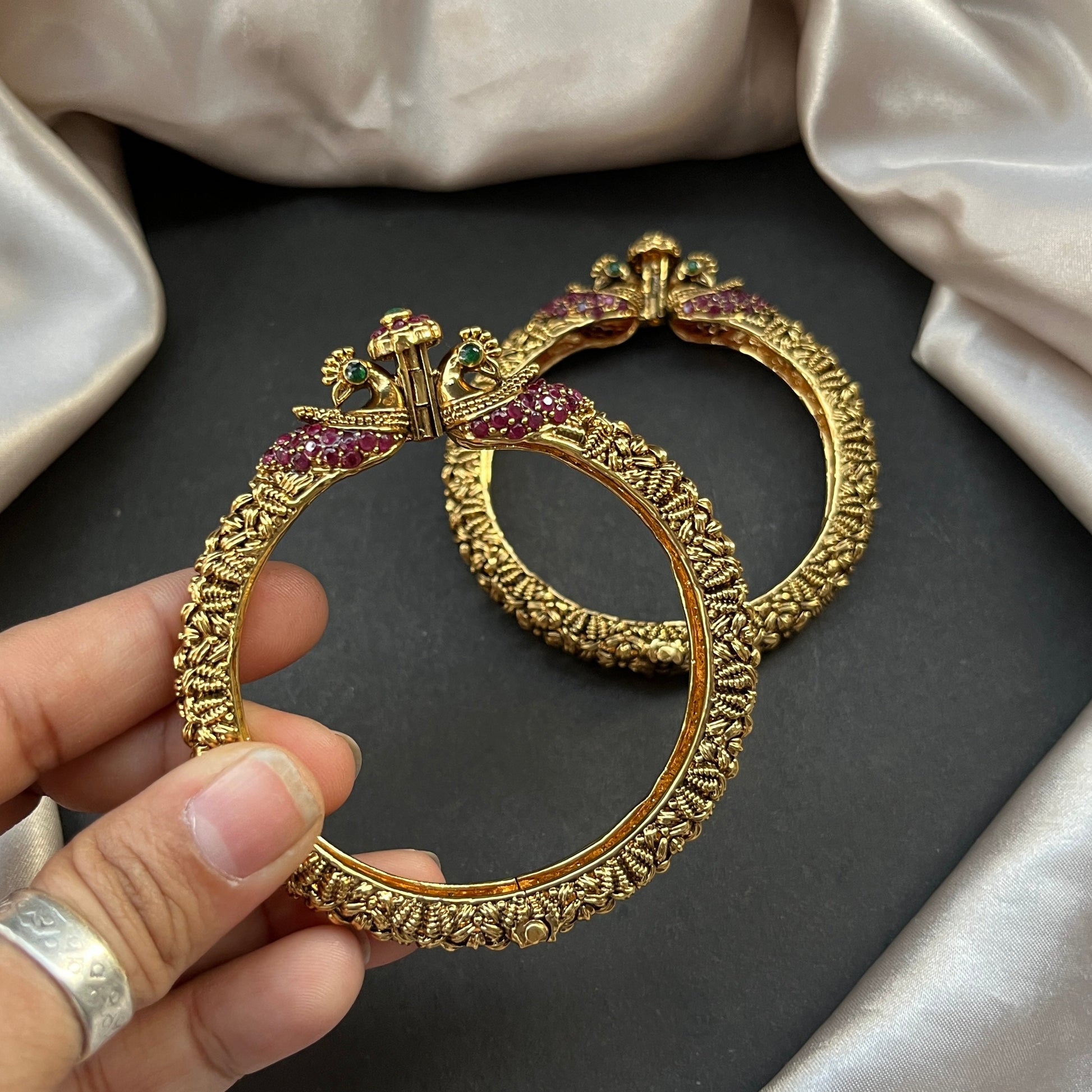 Traditional gold tone bangles with carved detailing imitation jewelry for weddings.Glossy gold look bangles in classic design – party wear imitation bangles for women