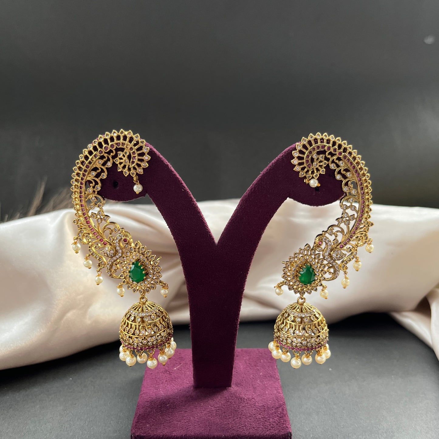 Traditional gold look South Indian stud earrings imitation jewelry with temple design motifs,Gold finish South Indian kemp earrings classic design with colorful stones for traditional outfits,South Indian gold tone jhumka earrings intricate detailing, perfect for festive and bridal wear