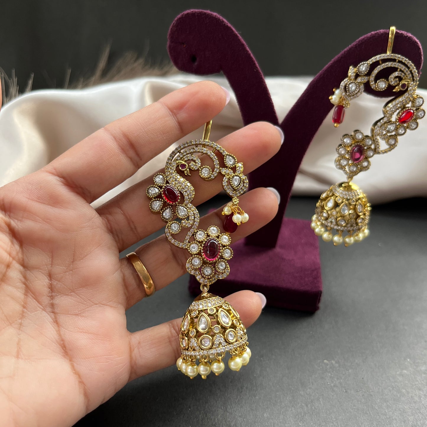 Traditional gold look South Indian stud earrings imitation jewelry with temple design motifs,Gold finish South Indian kemp earrings classic design with colorful stones for traditional outfits,South Indian gold tone jhumka earrings intricate detailing, perfect for festive and bridal wear