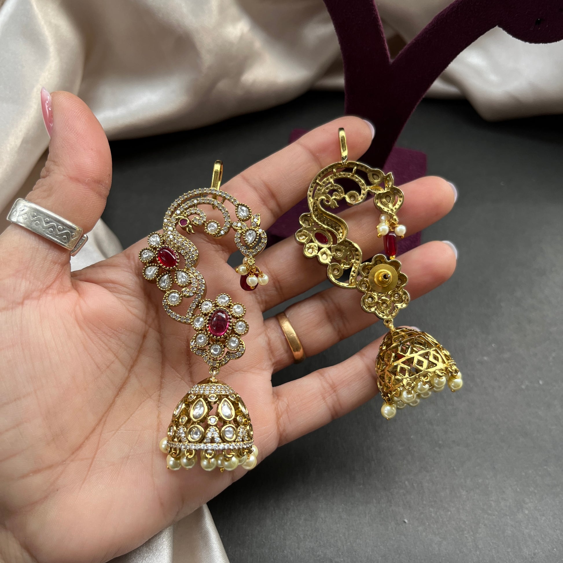 Traditional gold look South Indian stud earrings imitation jewelry with temple design motifs,Gold finish South Indian kemp earrings classic design with colorful stones for traditional outfits,South Indian gold tone jhumka earrings intricate detailing, perfect for festive and bridal wear
