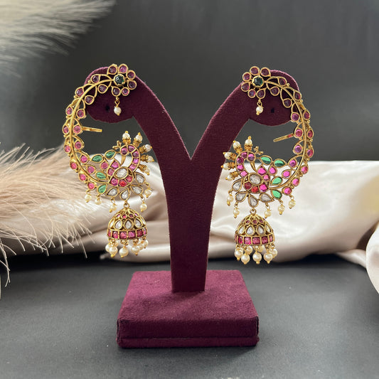 Traditional gold look South Indian stud earrings imitation jewelry with temple design motifs,Gold finish South Indian kemp earrings classic design with colorful stones for traditional outfits,South Indian gold tone jhumka earrings intricate detailing, perfect for festive and bridal wear
