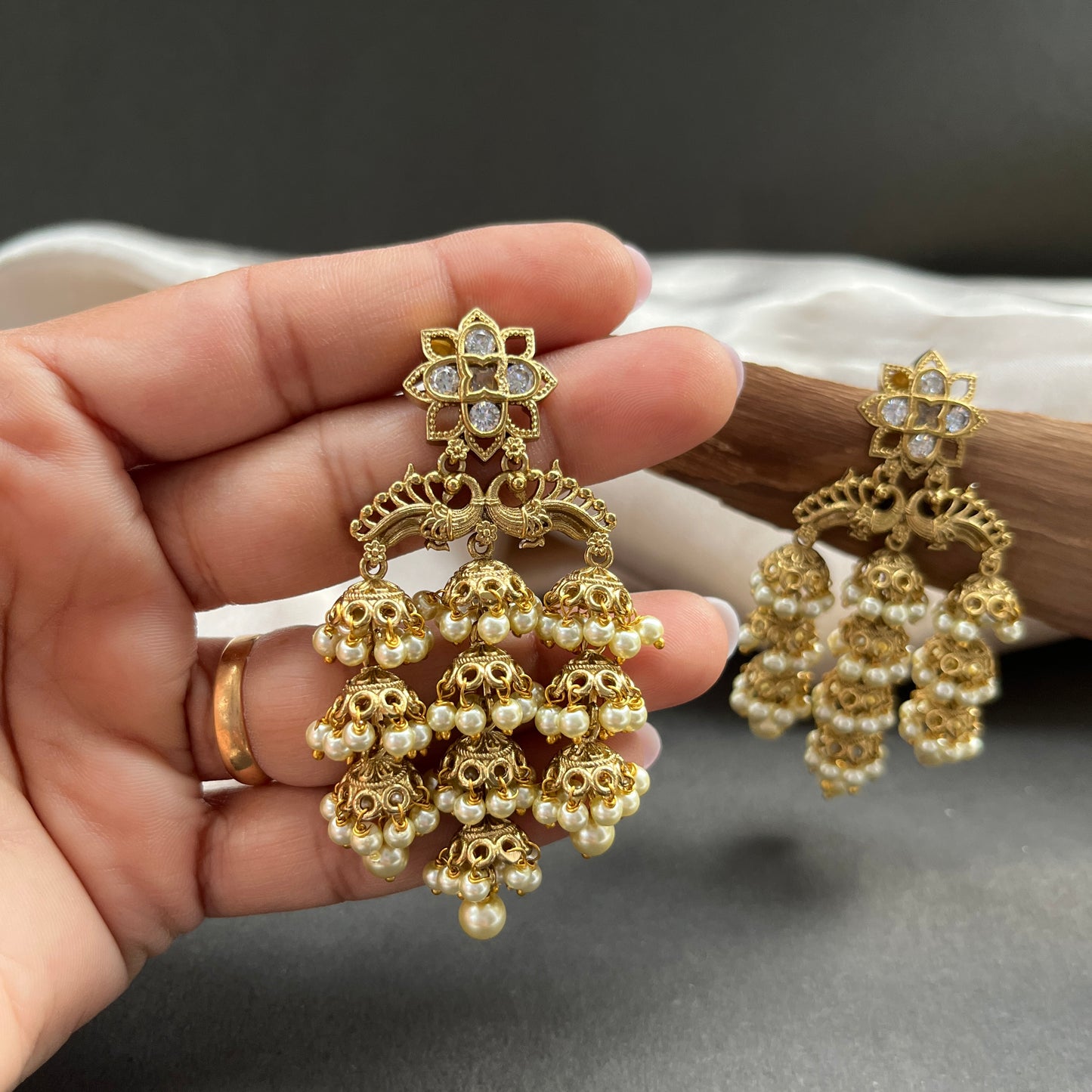 Traditional gold look South Indian stud earrings imitation jewelry with temple design motifs,Gold finish South Indian kemp earrings classic design with colorful stones for traditional outfits,South Indian gold tone jhumka earrings intricate detailing, perfect for festive and bridal wear