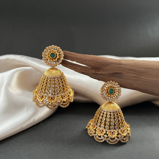 A timeless pair of jhumkis blending style and tradition, perfect for elevating any festive or everyday look

Weight - Light to Medium Weight

Note - 
Colour, shades, texture displayed may slightly vary from the actual product due to photography limitations. We humbly request you to consider these variations. We try our best to deliver the product pictures to 99% similar to the actual product