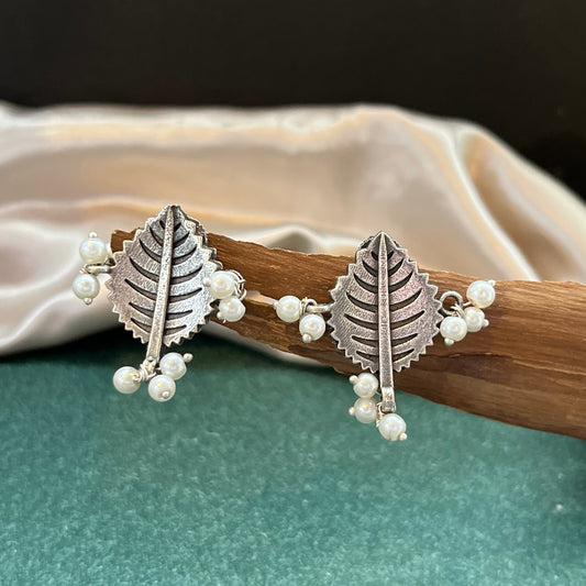 German silver look jhumka earrings oxidised finish with intricate temple design, perfect for festive wear,Vintage German silver look hoop earrings  boho inspired design for casual and traditional wear