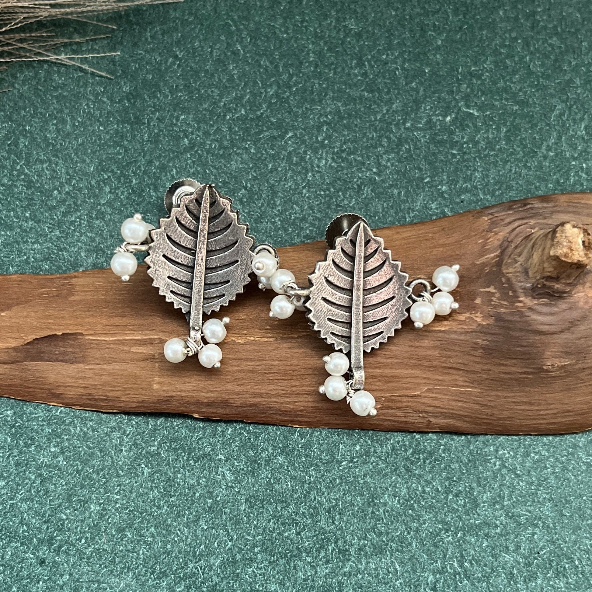 German silver look jhumka earrings oxidised finish with intricate temple design, perfect for festive wear,Vintage German silver look hoop earrings  boho inspired design for casual and traditional wear