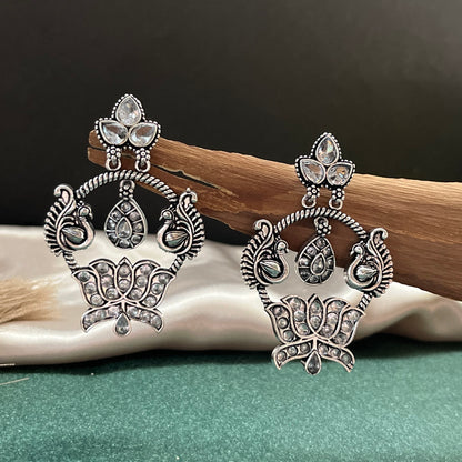 German silver look jhumka earrings oxidised finish with intricate temple design, perfect for festive wear,Vintage German silver look hoop earrings  boho inspired design for casual and traditional wear