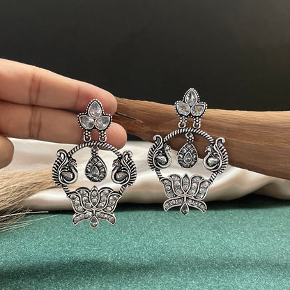 German silver look jhumka earrings oxidised finish with intricate temple design, perfect for festive wear,Vintage German silver look hoop earrings  boho inspired design for casual and traditional wear