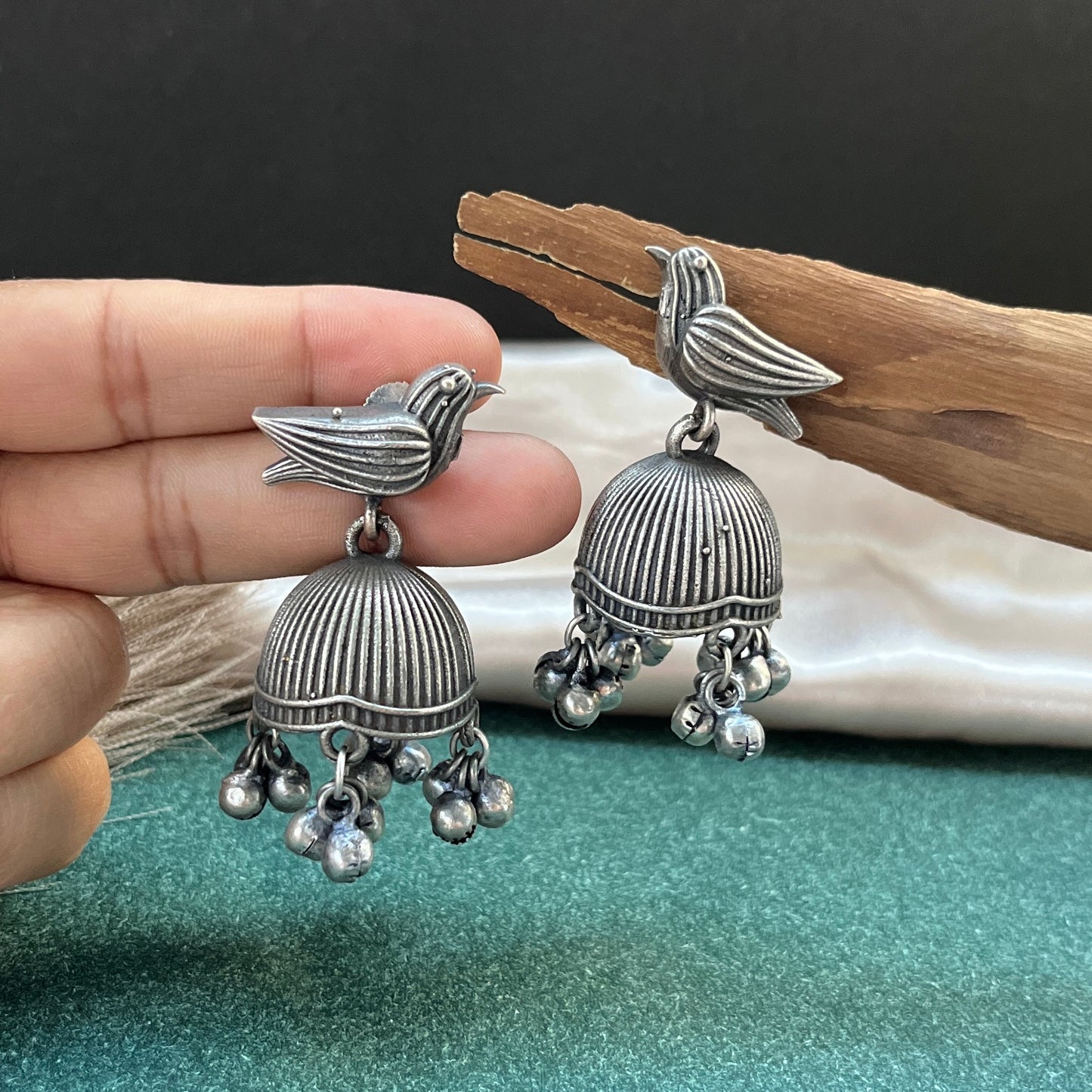 German silver look jhumka earrings oxidised finish with intricate temple design, perfect for festive wear,Vintage German silver look hoop earrings  boho inspired design for casual and traditional wear