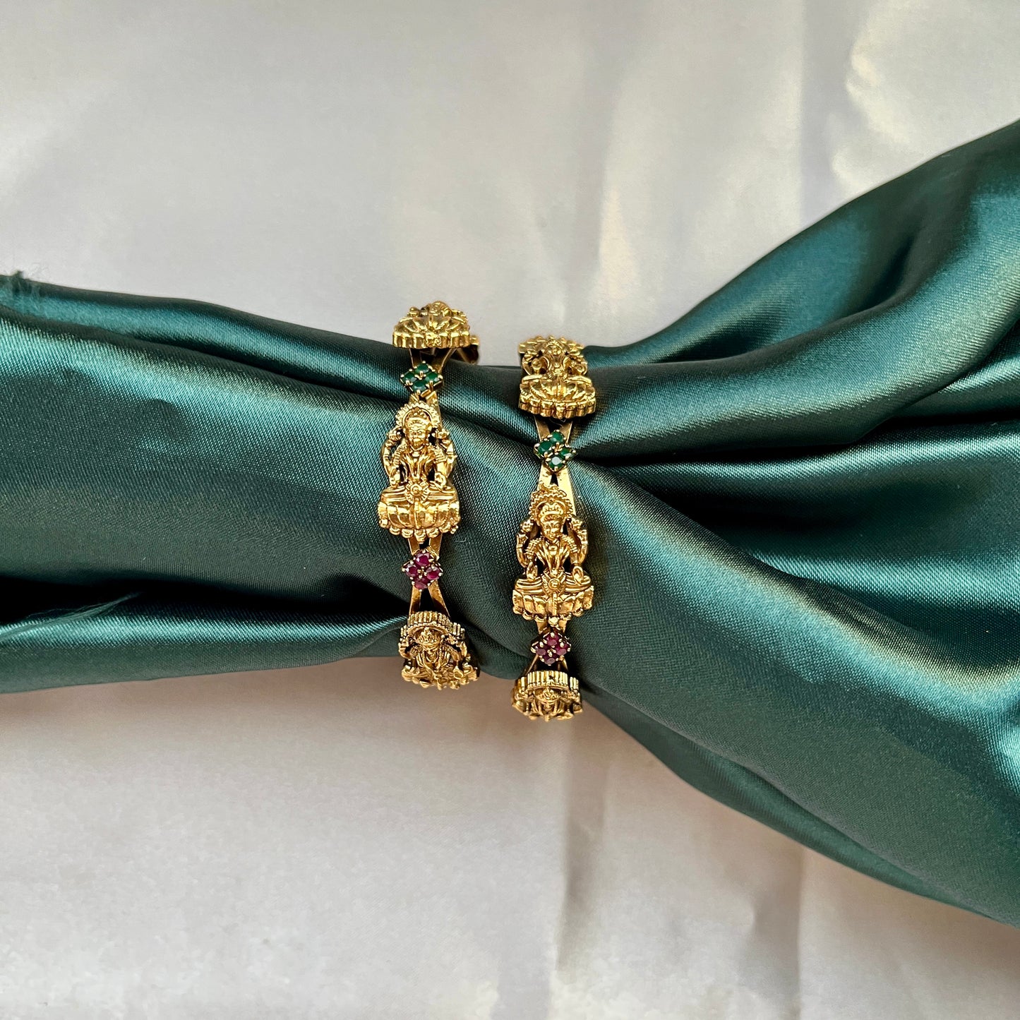 Traditional gold tone bangles with carved detailing imitation jewelry for weddings.Glossy gold look bangles in classic design  party wear imitation bangles for women
