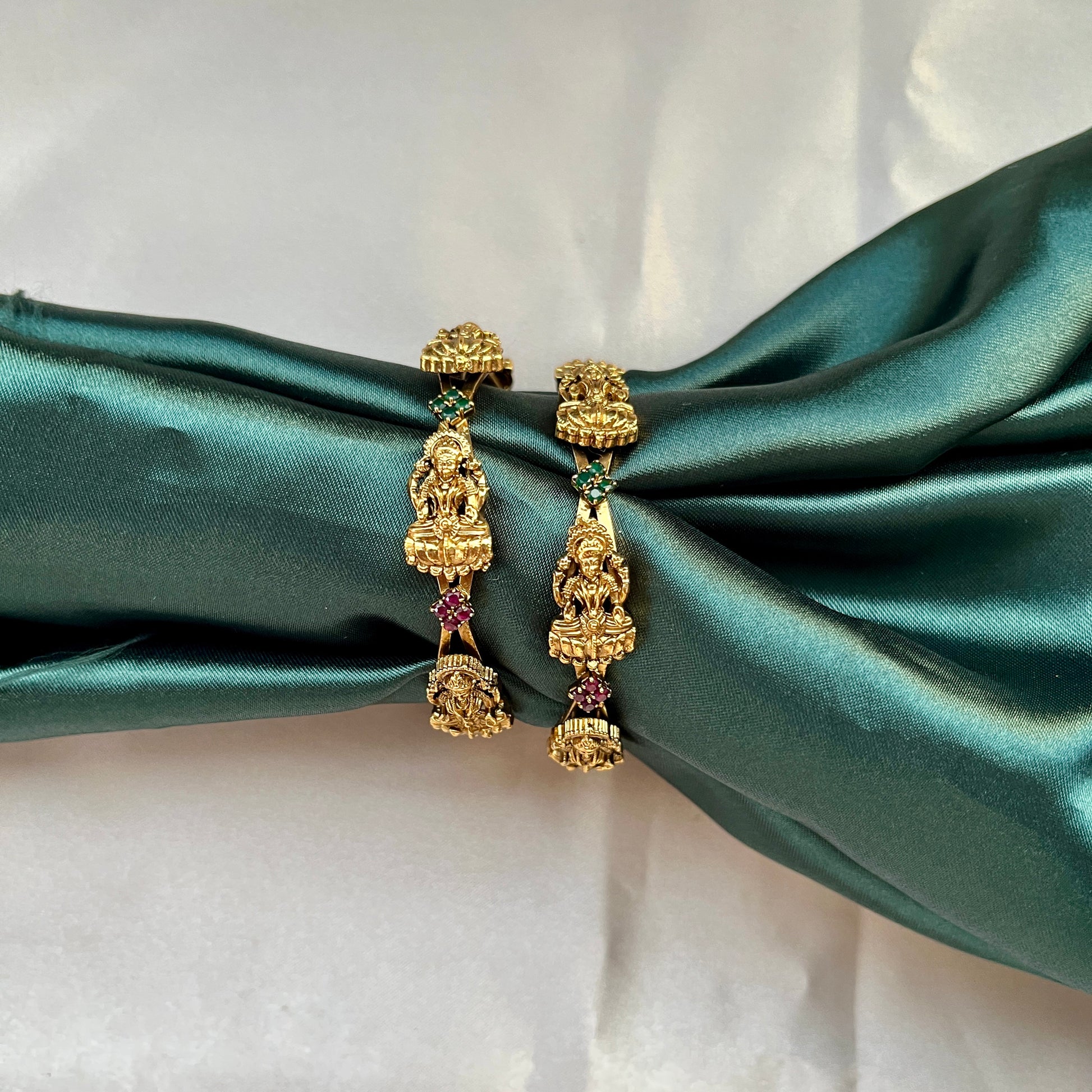 Traditional gold tone bangles with carved detailing imitation jewelry for weddings.Glossy gold look bangles in classic design  party wear imitation bangles for women
