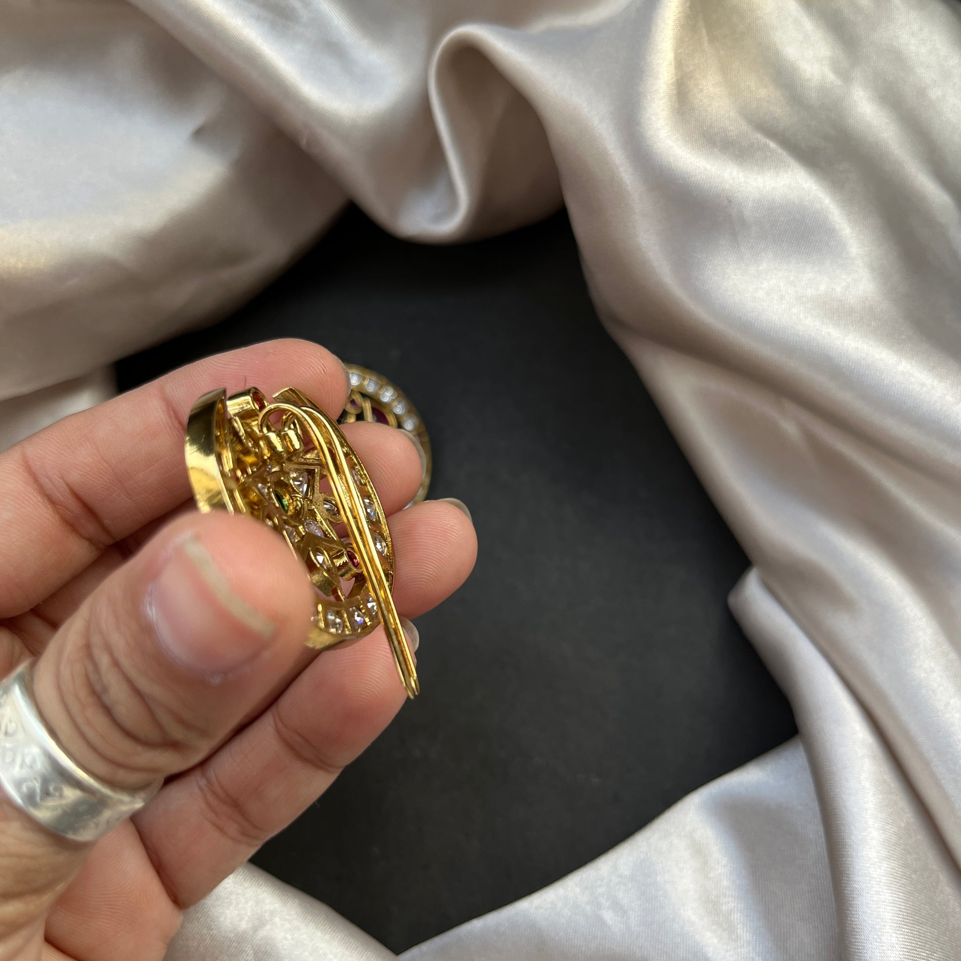 Traditional gold look South Indian stud earrings imitation jewelry with temple design motifs,Gold finish South Indian kemp earrings classic design with colorful stones for traditional outfits,South Indian gold tone jhumka earrings intricate detailing, perfect for festive and bridal wear