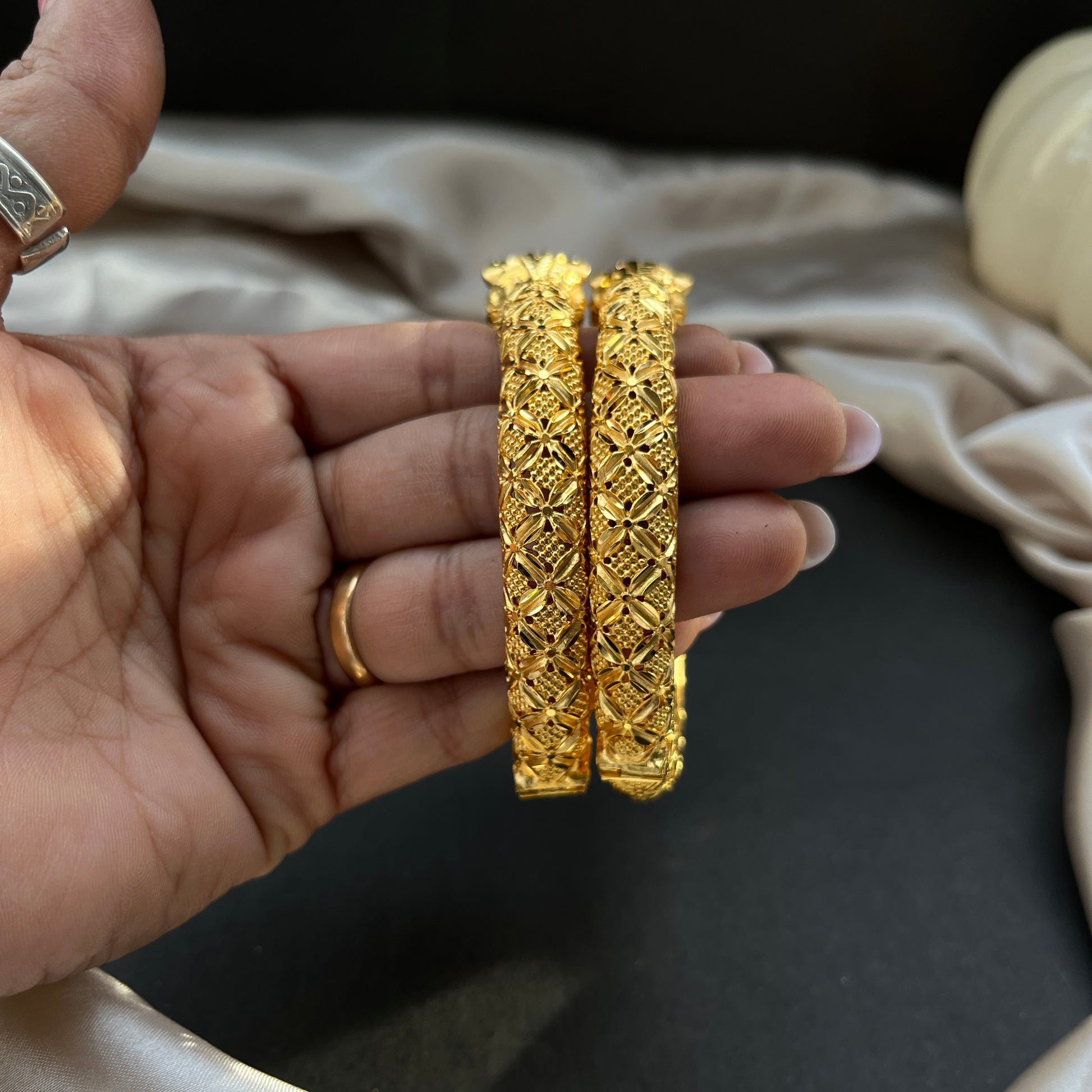 Traditional gold tone bangles with carved detailing imitation jewelry for weddings.Glossy gold look bangles in classic design  party wear imitation bangles for women