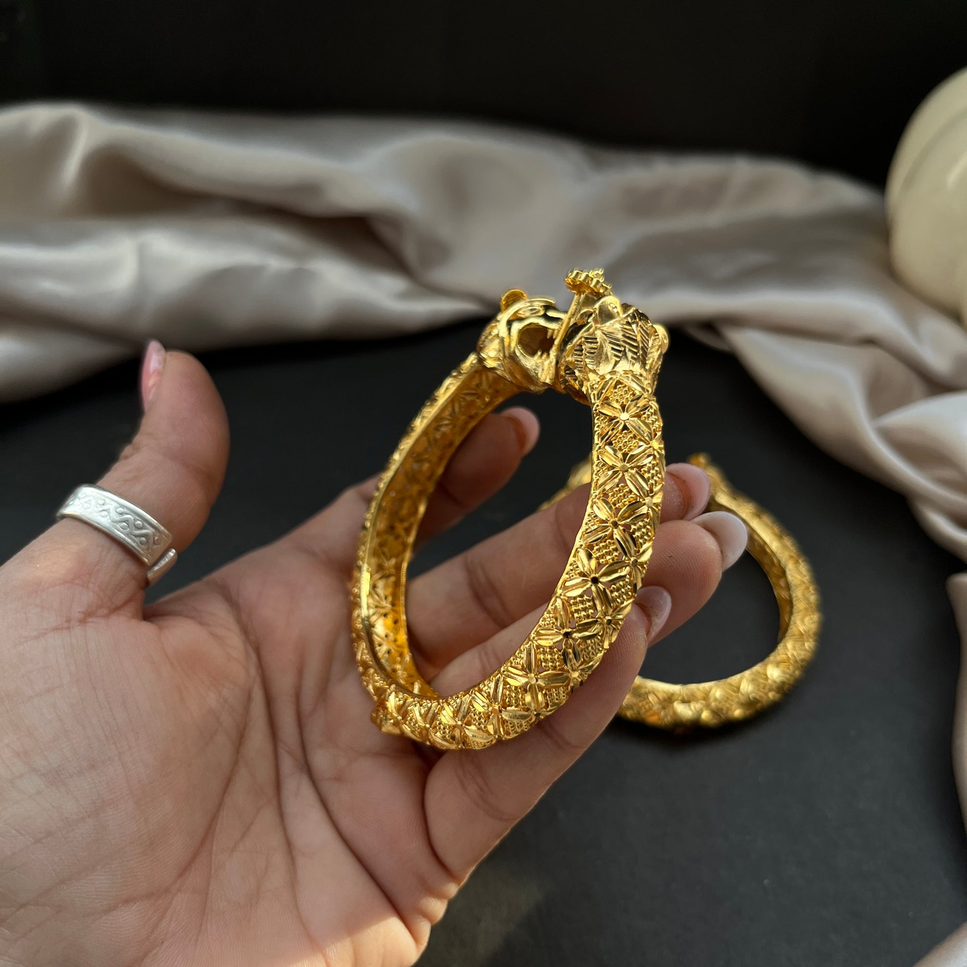 Traditional gold tone bangles with carved detailing imitation jewelry for weddings.Glossy gold look bangles in classic design  party wear imitation bangles for women
