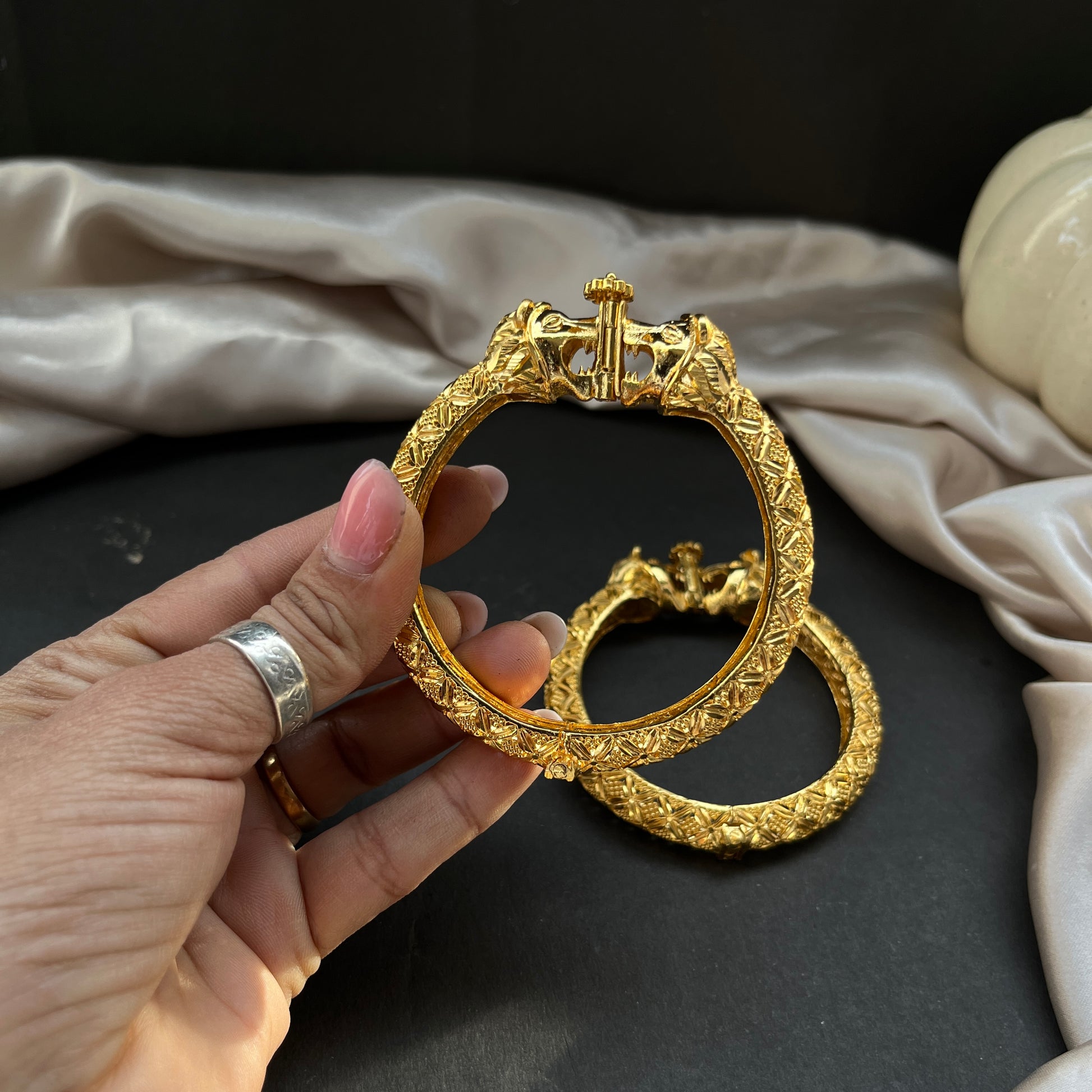Traditional gold tone bangles with carved detailing imitation jewelry for weddings.Glossy gold look bangles in classic design  party wear imitation bangles for women
