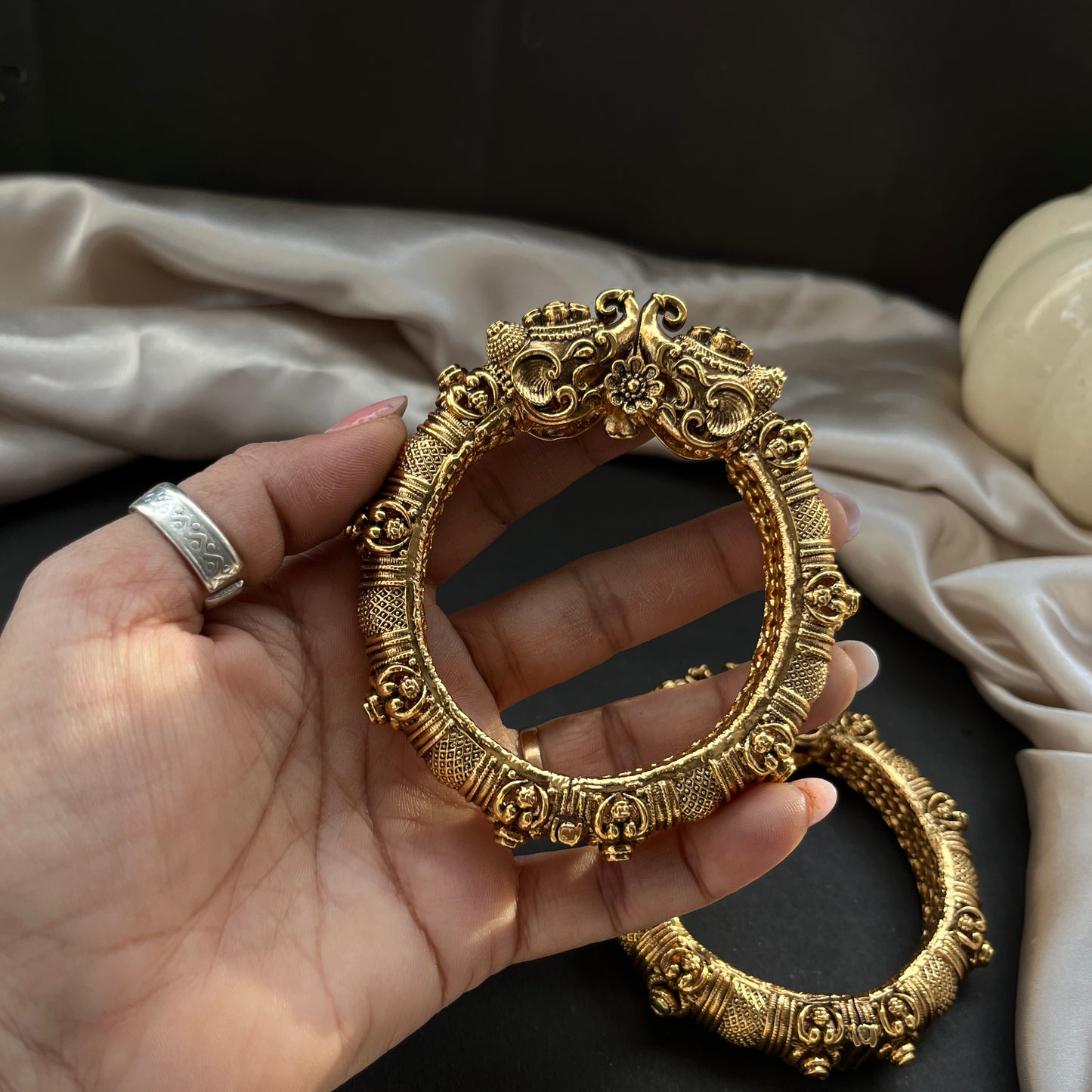 Traditional gold tone bangles with carved detailing imitation jewelry for weddings.Glossy gold look bangles in classic design  party wear imitation bangles for women