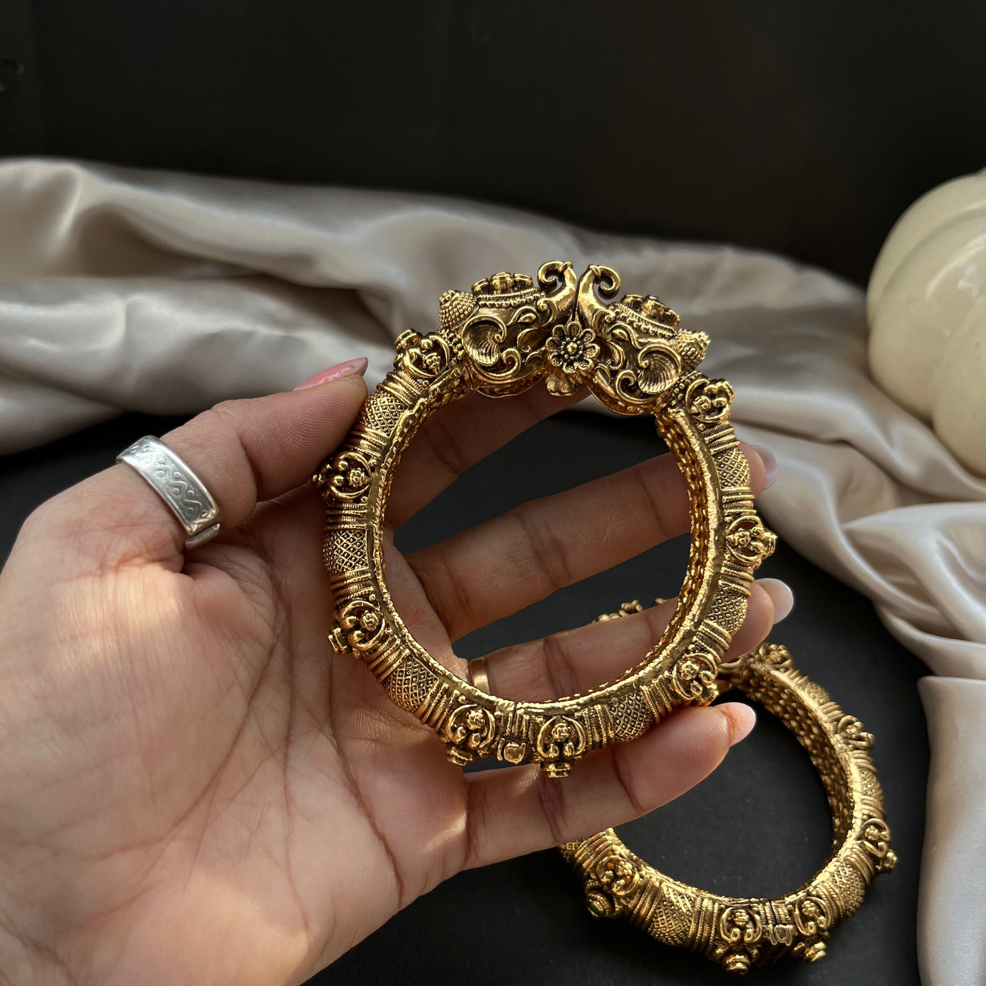 Traditional gold tone bangles with carved detailing imitation jewelry for weddings.Glossy gold look bangles in classic design  party wear imitation bangles for women