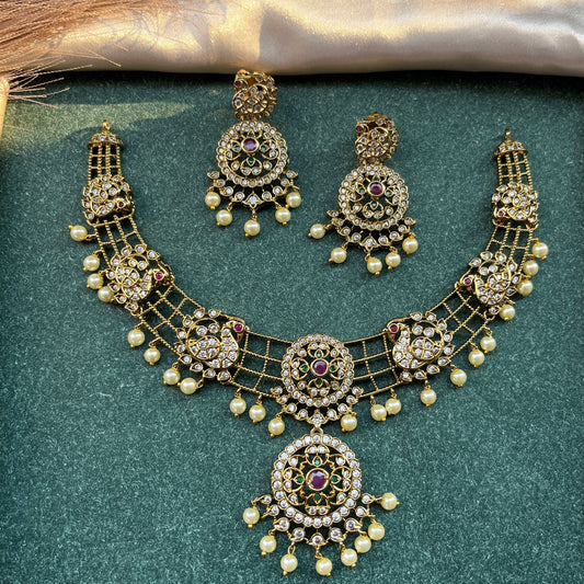 Gold look alike necklace set,Imitation jewelry,Artificial necklace set,Bridal / festive wear,Temple design / kundan / matte gold finish,Designer / traditional / ethnic